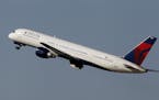 File-This photo taken Jan. 20, 2011, shows a Delta Airlines Boeing 757 taking off in Tampa, Fla. Delta Air Lines is making fundamental changes to its 