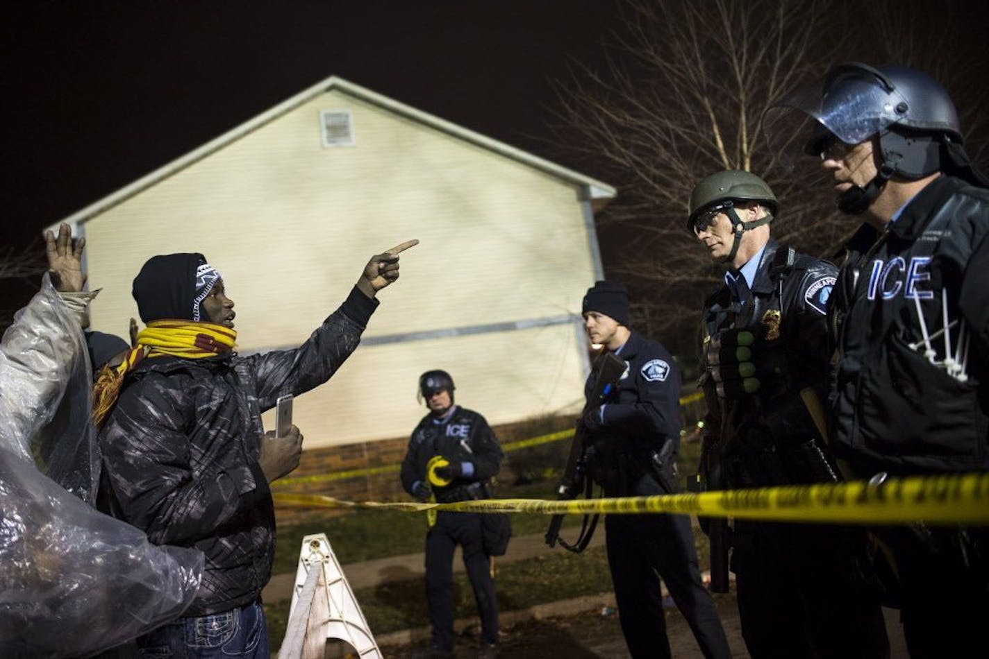 Protestors squared off with police outside the Fourth Precinct in north Minneapolis in the early hours of Thursday, Nov. 19, 2015.