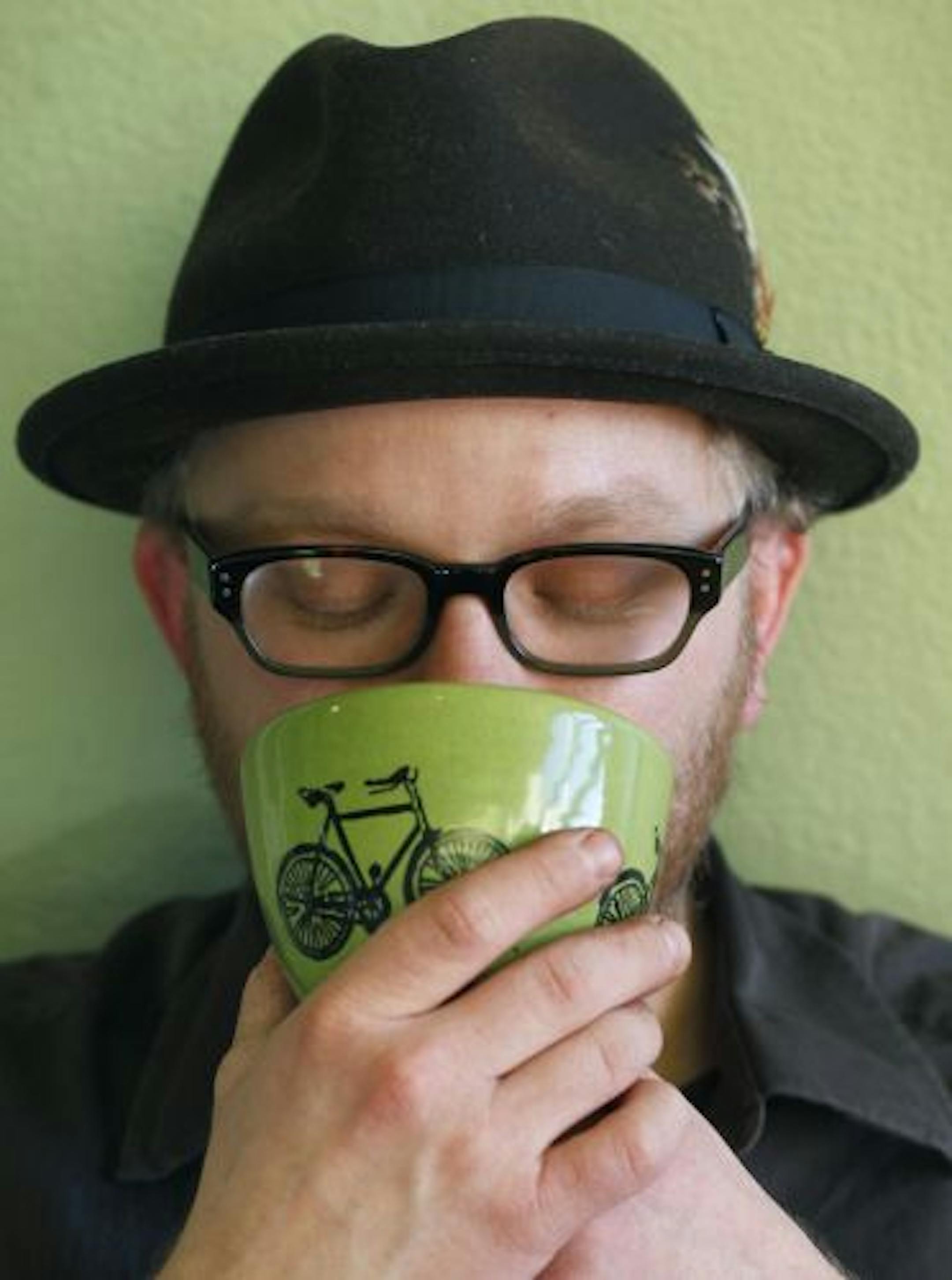 Coffee fanatic Andrew Kopplin takes a restorative sip of hot chocolate.
