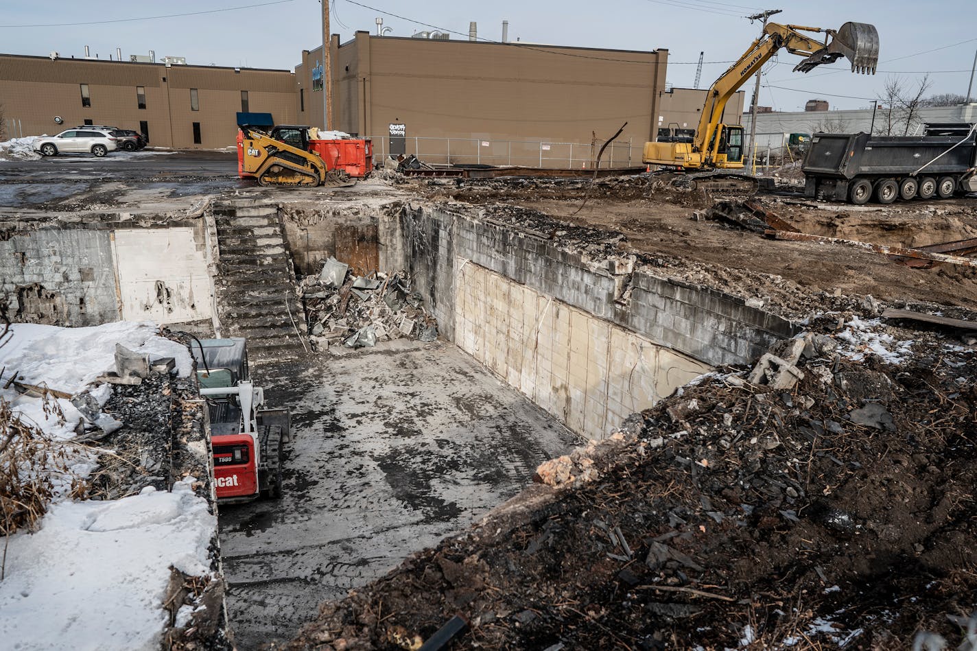 A demolition crew loaded concrete in trucks at the Atlas Staffing site on East Lake Street in Minneapolis earlier in January.