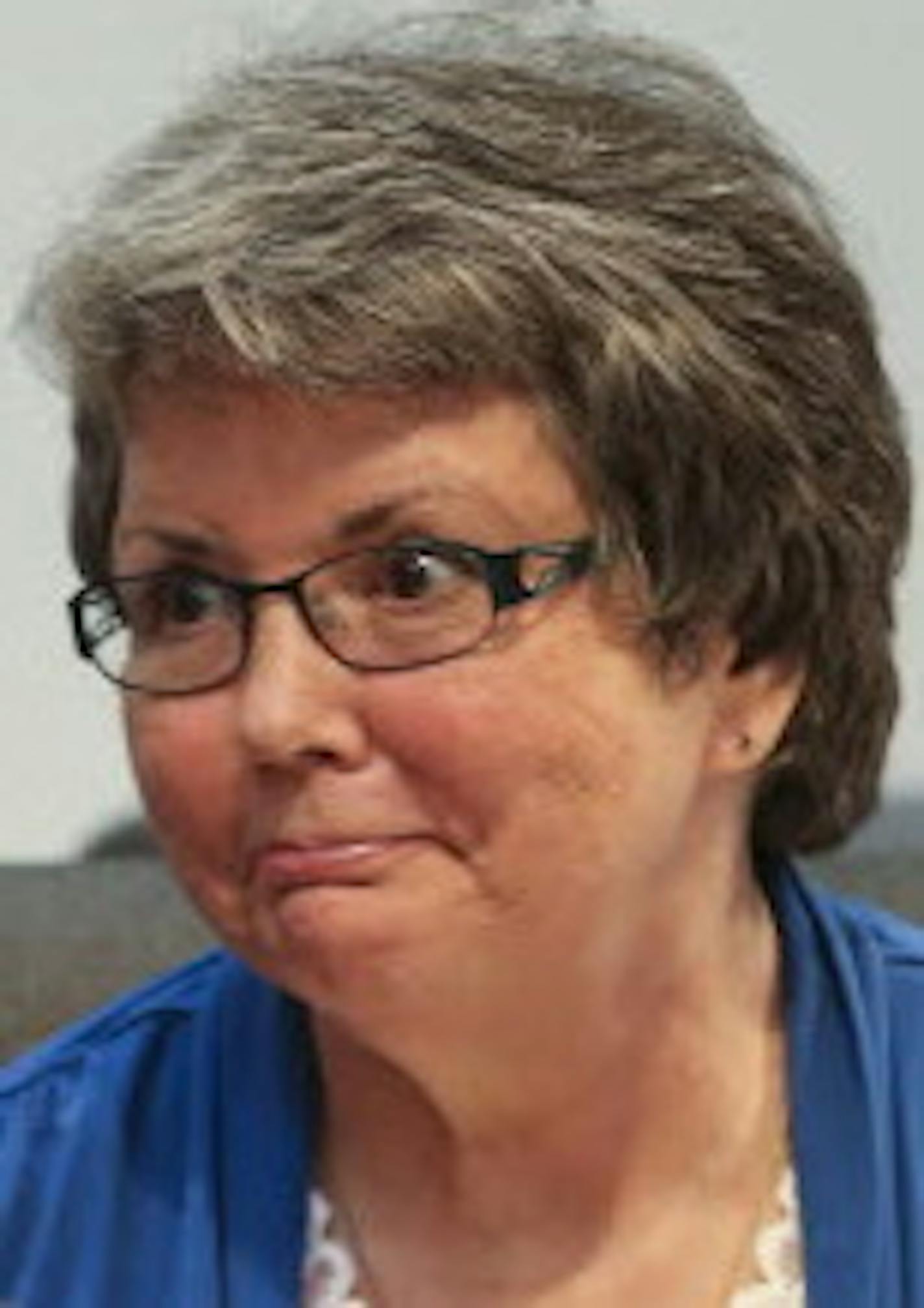 Council member LeAnn Sargent chatted with fellow council members before a city council meeting on Monday, August 4, 2014, in Maple Grove, Minn. More than a dozen residents were at Monday's Maple Grove City Council meeting to protest council member LeAnn Sargent's return to the council.