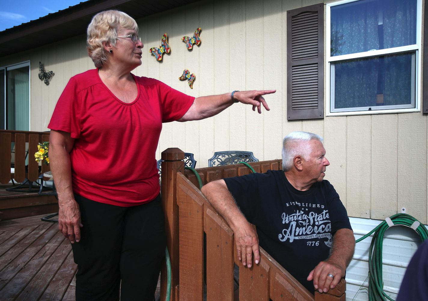 Aggie Jensen points at the high waters overflowed from the Nemadji River as her husband, Gordon, looks on. Aggie, who was physically born in this house, said she has never seen flooding like this in her lifetime. ] ALEX KORMANN &#x2022; alex.kormann@startribune.com Ten inches of rain fell on Superior, WI over the weekend of June 17th. The heavy rainfall caused rivers to overflow and major flooding to plague the surrounding areas. Many county roads were destroyed or under water and home owners in