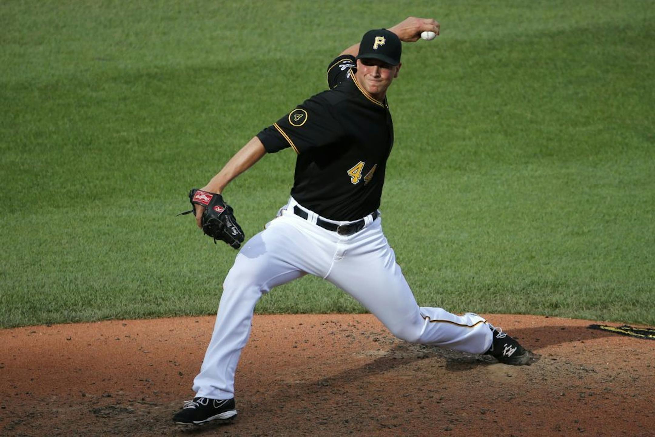 Pittsburgh Pirates relief pitcher Tony Watson delivers during the eighth inning of a baseball game against the Philadelphia Phillies in Pittsburgh Saturday, July 5, 2014.