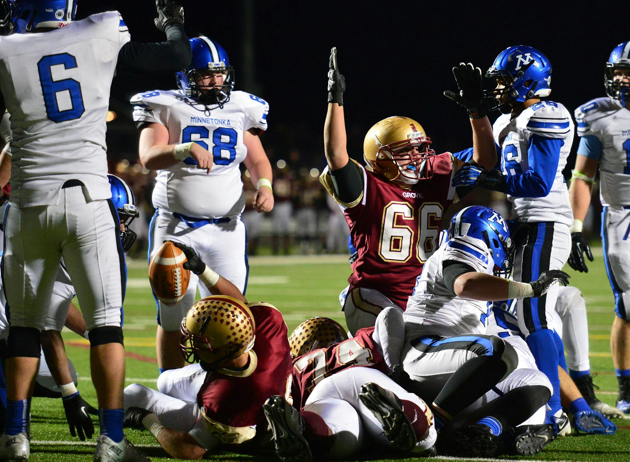 Maple Grove 22 Clark Wieneke carried the ball in the second quarter for the team's first touchdown. in the Minnetonka played at Maple Grove in Class 6A football. The winner of Friday's game goes on to the State Tournament. Friday, November 1, 2013. ] GLEN STUBBE * gstubbe@startribune.com