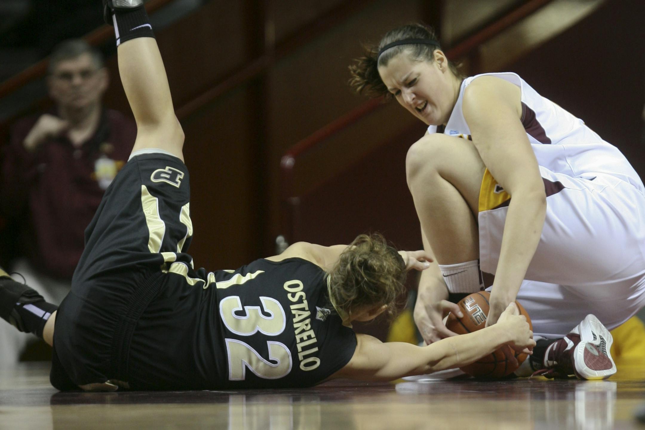 The Gophers' Amber Dvorak (right) fought for possession of the ball with Purdue's Sam Ostarello.