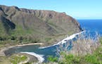 At the end of the road on the island of Molokai is the remote Halawa Valley and its peaceful crescent of beach.