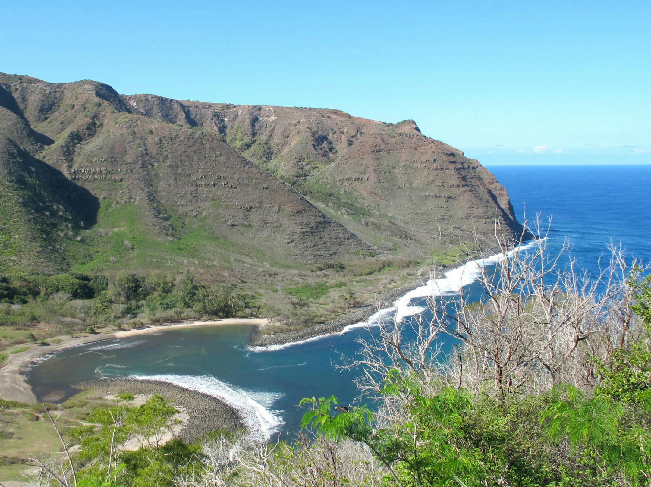 At the end of the road on the island of Molokai is the remote Halawa Valley and its peaceful crescent of beach.