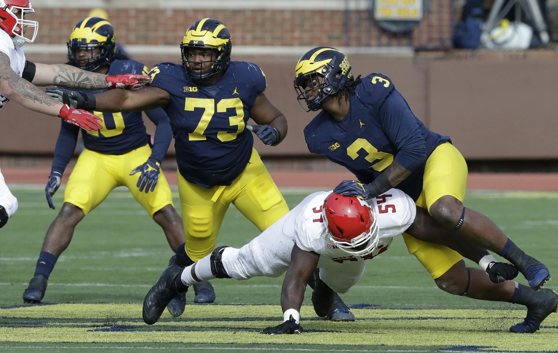 Michigan defensive linemen Rashan Gary (3) and Maurice Hurst (73) go up against the Rutgers offensive line during the first half of an NCAA college football game, Saturday, Oct. 28,2017, in Ann Arbor, Mich. (AP Photo/Carlos Osorio)