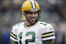 Green Bay Packers quarterback Aaron Rodgers warms up before an NFL football game against the Oakland Raiders Sunday, Dec. 20, 2015, in Oakland, Calif.