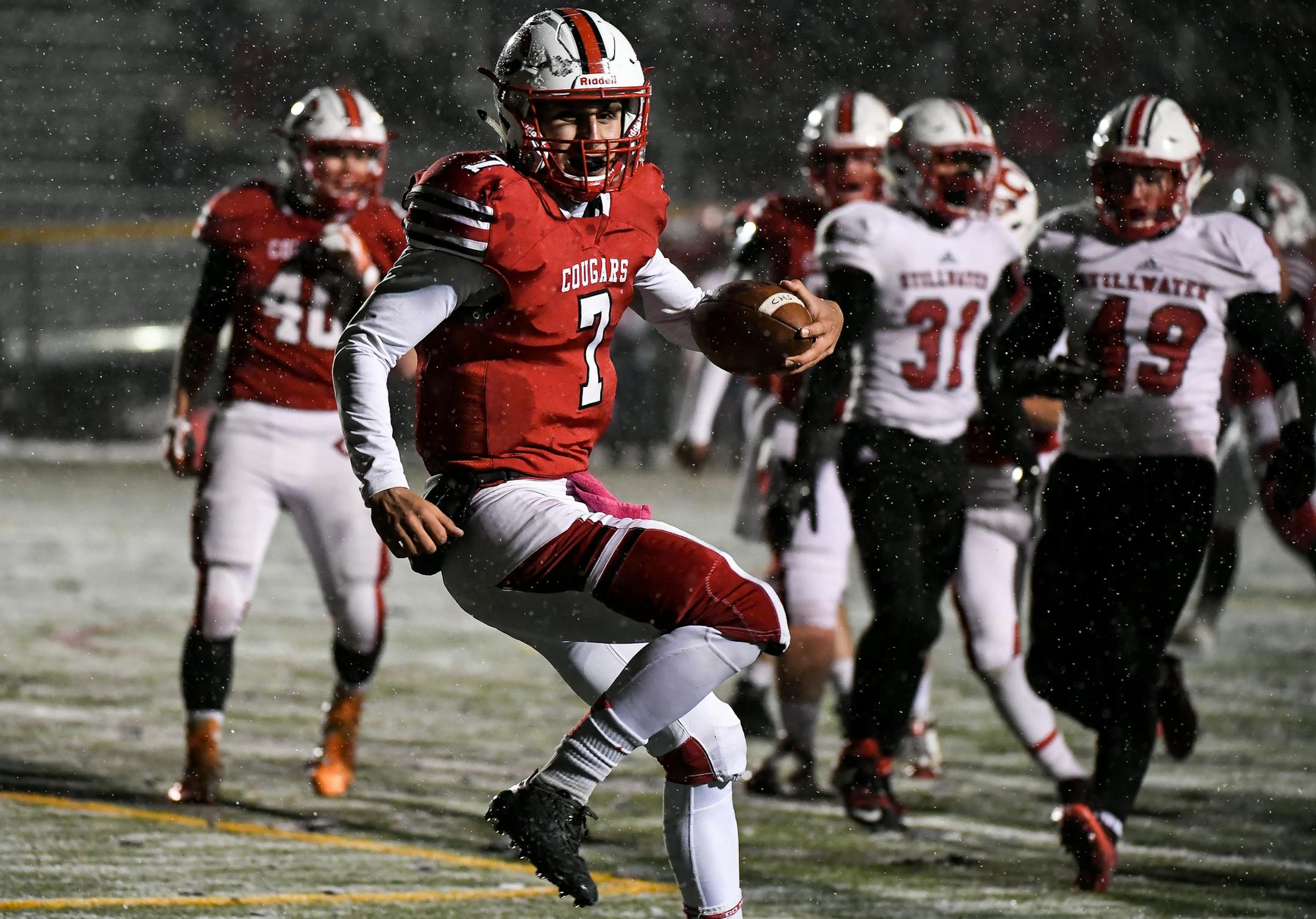 Centennial quarterback Ryan Koob (7) ran into the end zone for a touchdown in the first quarter against Stillwater. ] AARON LAVINSKY ï aaron.lavinsky@startribune.com Centennial played Stillwater in a Class 6A playoff football game on Friday, Oct. 27, 2017 at Centennial High School in Circle Pines, Minn.