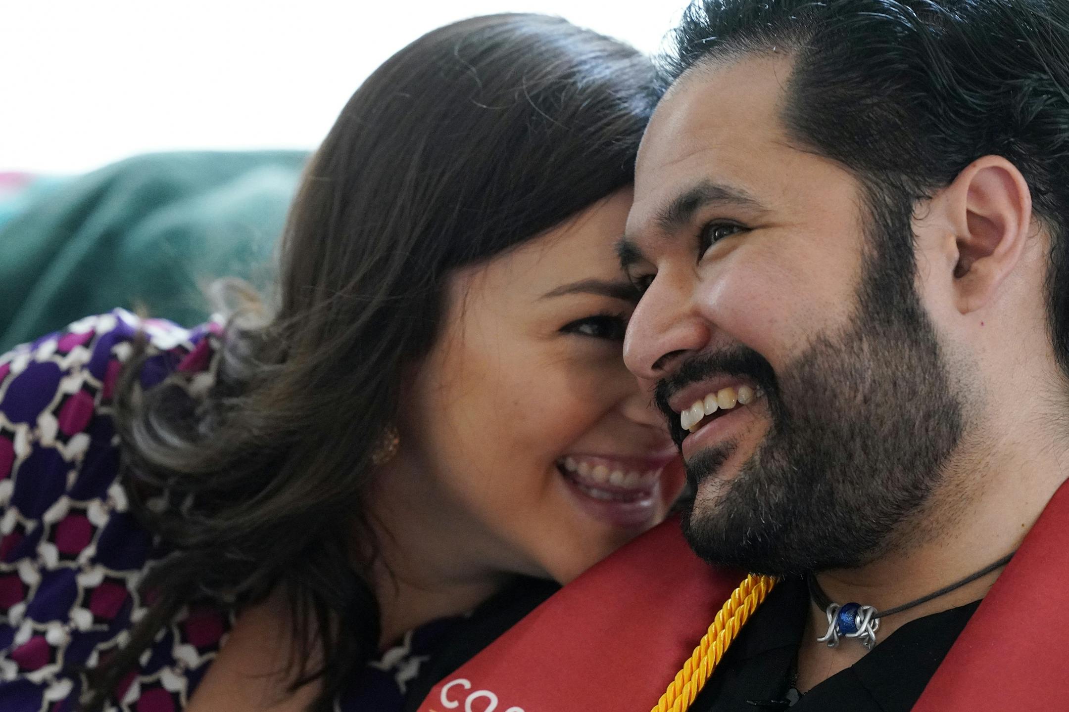 Izaak Mendoza watched the video commencement address in his graduation robes alongside his wife Becky and his family who were on a video call from their home in Wyoming Saturday.