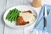 Buttermilk Brined Country Fried Pork Chops with Creamy Black Pepper Gravy is dinner tonight. Credit: Meredith Deeds, Special to the Star Tribune