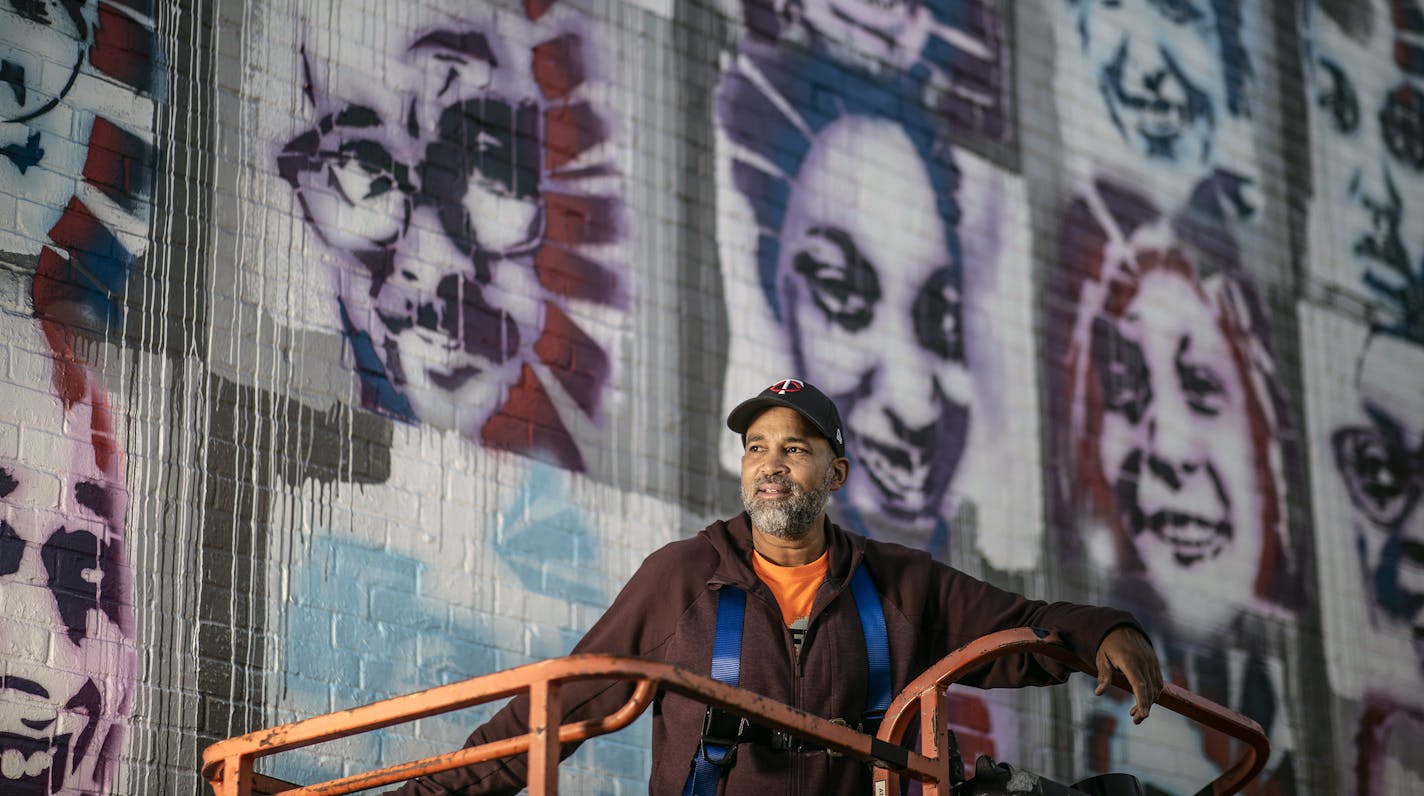 Profile of artist Peyton Scott Russell as he works on a elaborate mural at City of Lakes Community Land Trust that utilizes stencils that people created of themselves .] Jerry Holt •Jerry.Holt@startribune.com Profile of artist Peyton Scott Russell, who painted the massive George Floyd piece at 38th and Chicago. Russell is currently working on beautiful, elaborate mural at City of Lakes Community Land Trust that utilizes stencils that people created of themselves Thursday September 10,2020 in Min