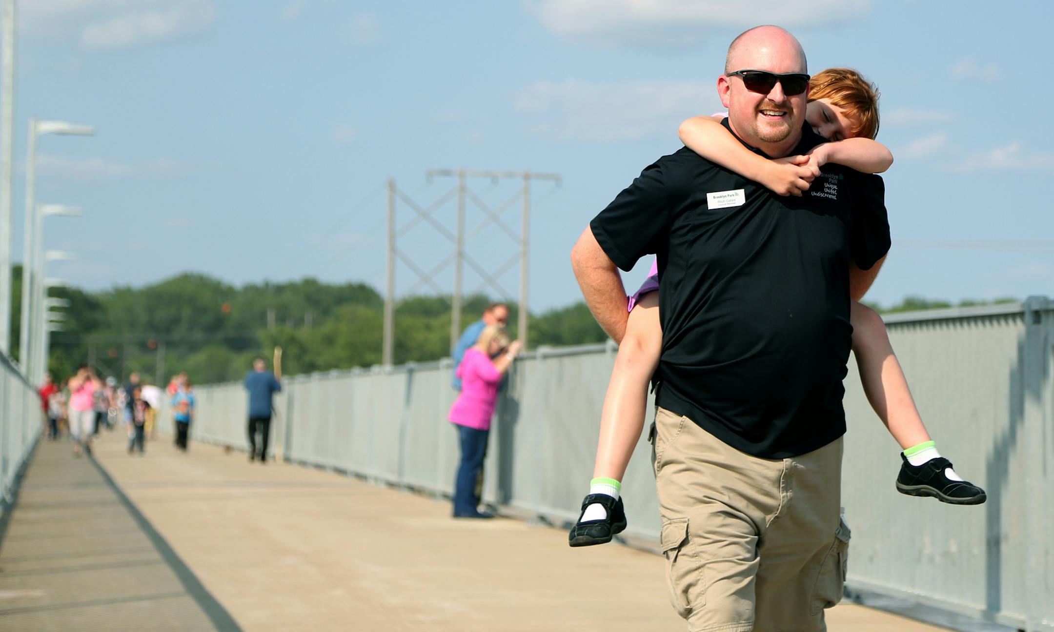 Rich Gates, Brooklyn Park council member, and daughter Parker, 7, toured the newly reopened walkway on the Coon Rapids Dam in Brooklyn Park.