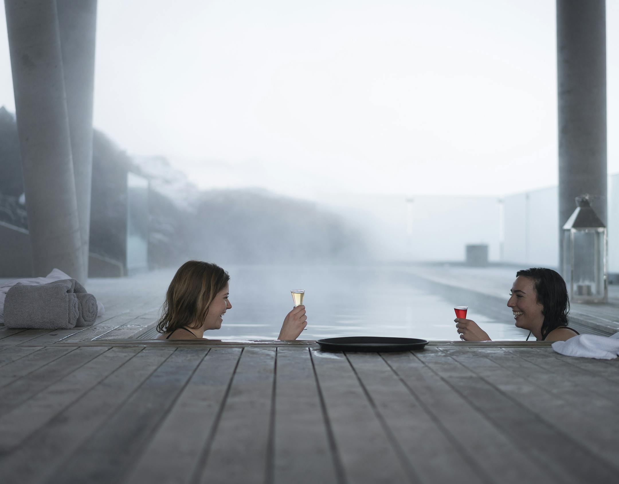 PHOTO MOVED IN ADVANCE AND NOT FOR USE - ONLINE OR IN PRINT - BEFORE DEC. 27, 2015. -- Guests toast while staying toasty in a thermal pool at the Ion, a geothermal bunker converted to a Design Hotel in Nesjavellir, 25 miles east of Reykjavik, Iceland, Dec. 13, 2015. There is a craft liquor revolution underway in Iceland, where geothermal energy, lava-rock filtration and an Arctic-grazing terroir combine to produce exceptional spirits with unique flavors. (Bara Kristinsdottir/The New York Times)