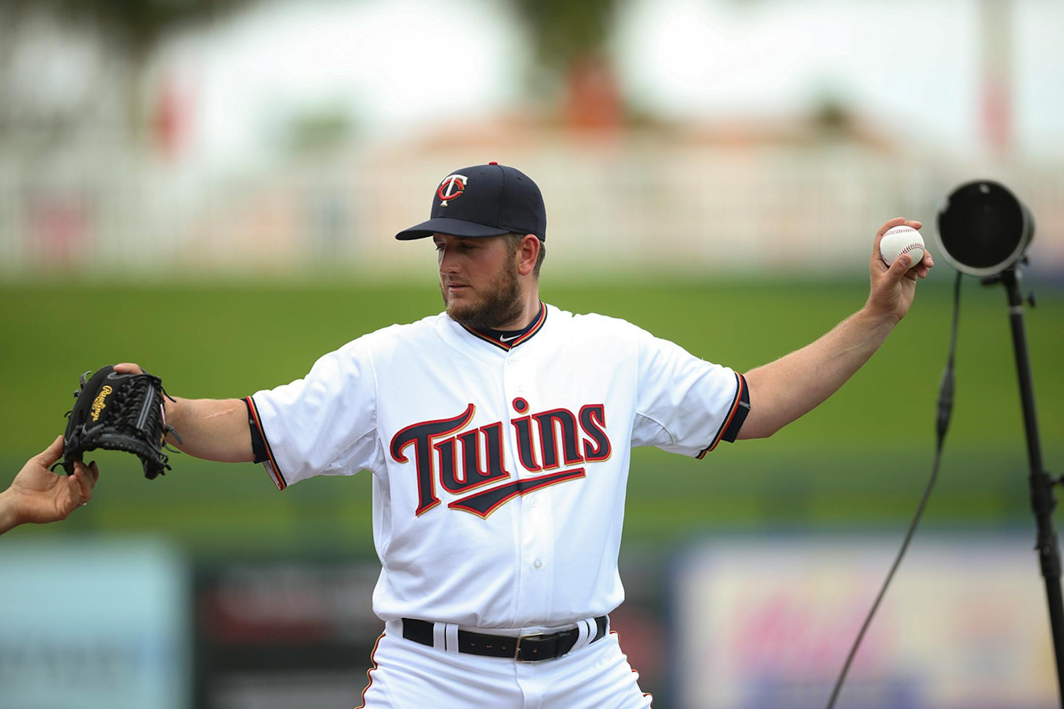 A photographer posed Twins pitcher Glen Perkins during a shoot Saturday, Feb. 28, at Hammond Stadium.