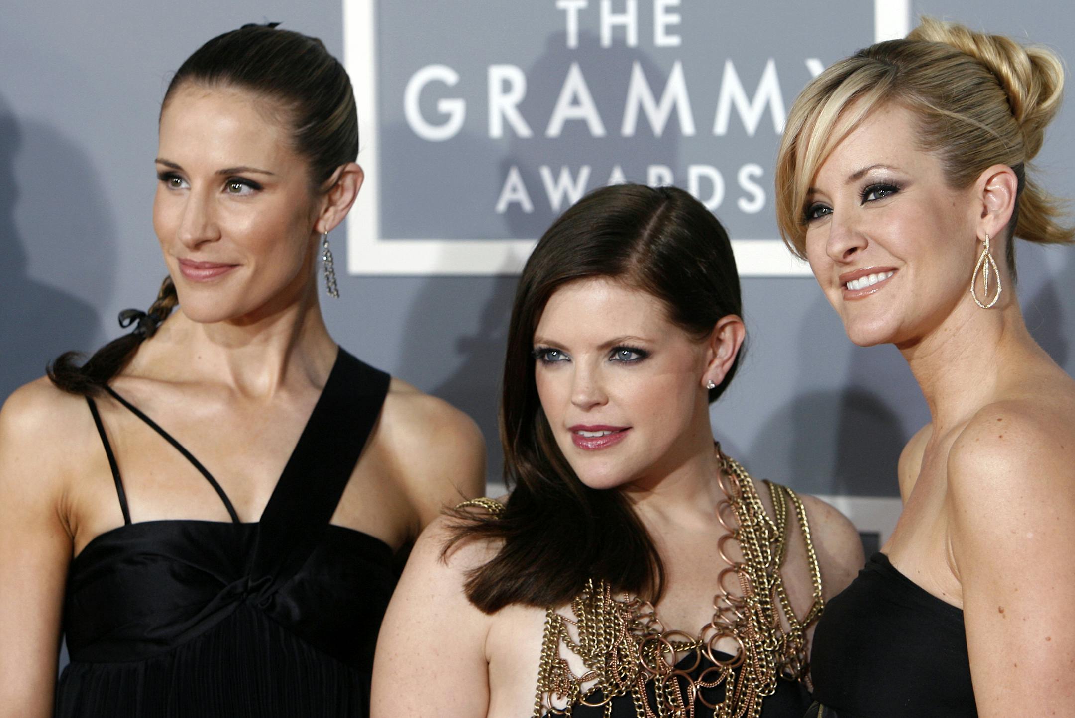 FILE - In this Feb. 11, 2007, file photo, the Dixie Chicks, Emily Robison, left, Natalie Maines, center, and Martie Maguire, who earned five Grammy nominations, arrive for the 49th Annual Grammy Awards in Los Angeles.