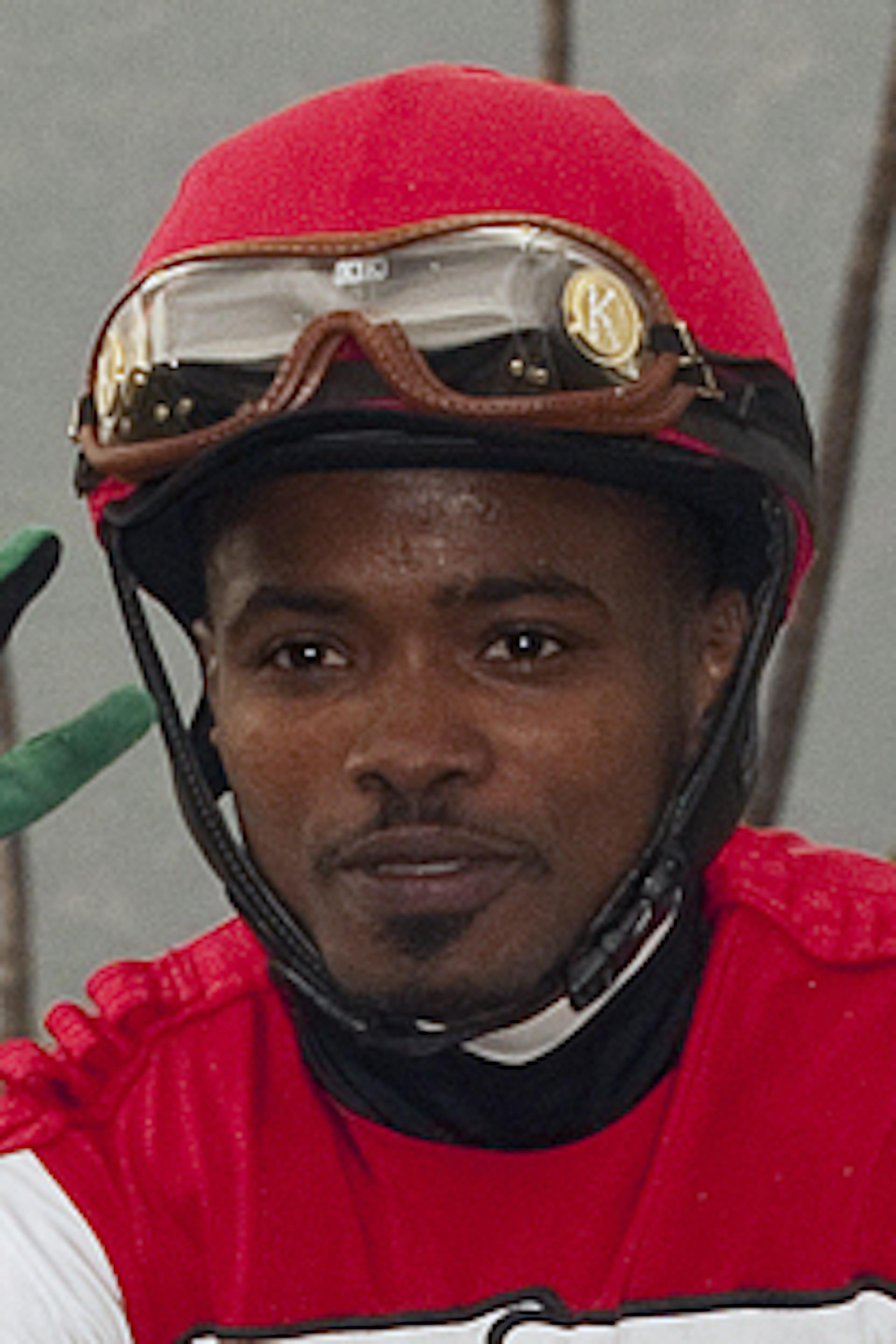 In this photo provided by Benoit Photo, jockey Kevin Krigger and Leandro Mora, left, assistant to trainer Doug OíNeill, smiles after Krigger wins four races in-a-row, taking Fridayís, April 5, 2013, sixth race at Santa Anita Race horse race in Arcadia, Calif., aboard A Thousand Aces for OíNeill, who also recorded his fourth win on the dayóthree of them in combination with Krigger. The red-hot twosome will swing for the fences in Saturdayís (April 6) Grade I, $750,000 San