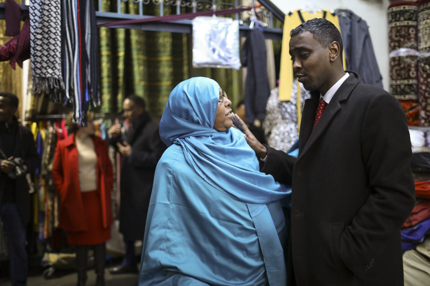 Minneapolis City Council member Abdi Warsame spoke with shopkeeper Fadumo Mohamed while he led Mayor Betsy Hodges, rear, on a swing through the Village Market Thursday afternoon. ] JEFF WHEELER &#xef; jeff.wheeler@startribune.com Minneapolis City Council member Abdi Warsame is making it his mission to take on the Sabri family of landlords that own the two Somali malls in Minneapolis. Tenants complain about conditions in the Village Market on 24th St. but fear reprisals if they bring their concer