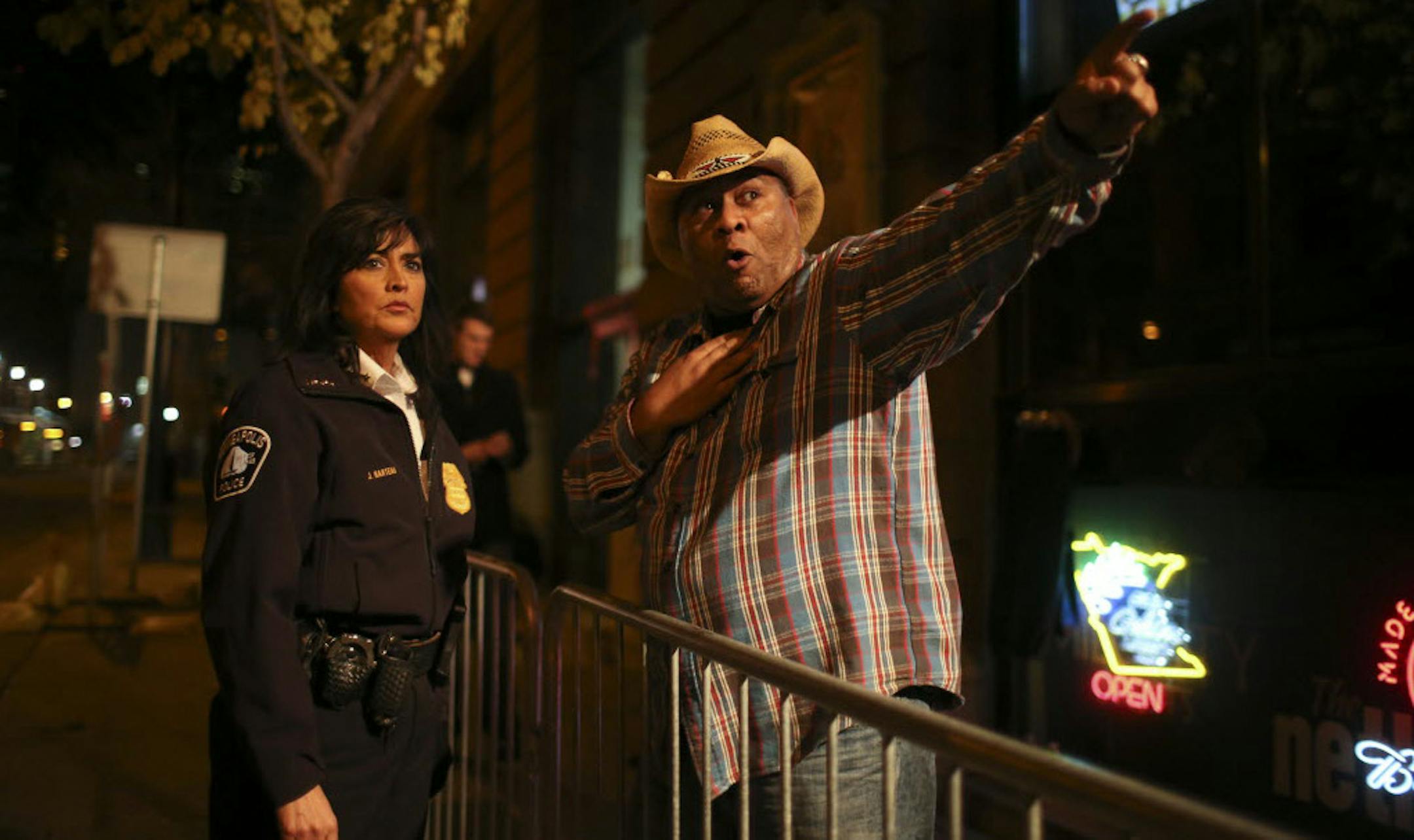 Minneapolis Police Chief Janee Harteau listens to James Ryan, who works at the Epic nightclub, talk about the traffic flow out of nearby Ramp B.