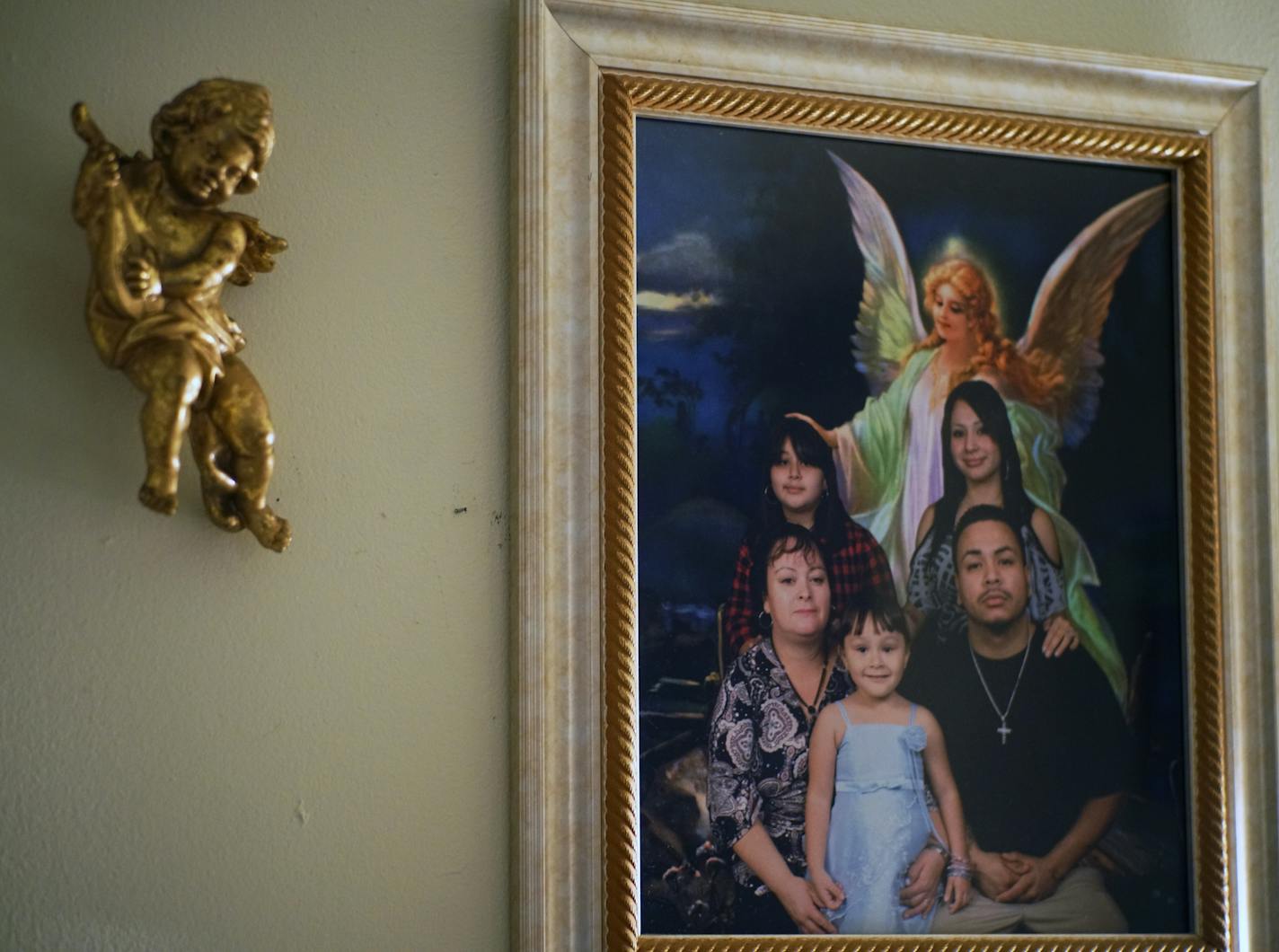 Adela's Trejo's family portrait hangs on one of the walls. She has lived there for 5 years. ]West St. Paul yanked the rental license of a landlord in late September, effectively leaving residents of 30 units homeless at year's end -- but the landlord is fighting back. City staff call their actions a last resort and allege the property has a history of excessive 911 calls and an unresponsive landlord. Richard Tsong-Taatarii/Richard.tsong-taatarii@startribune.com