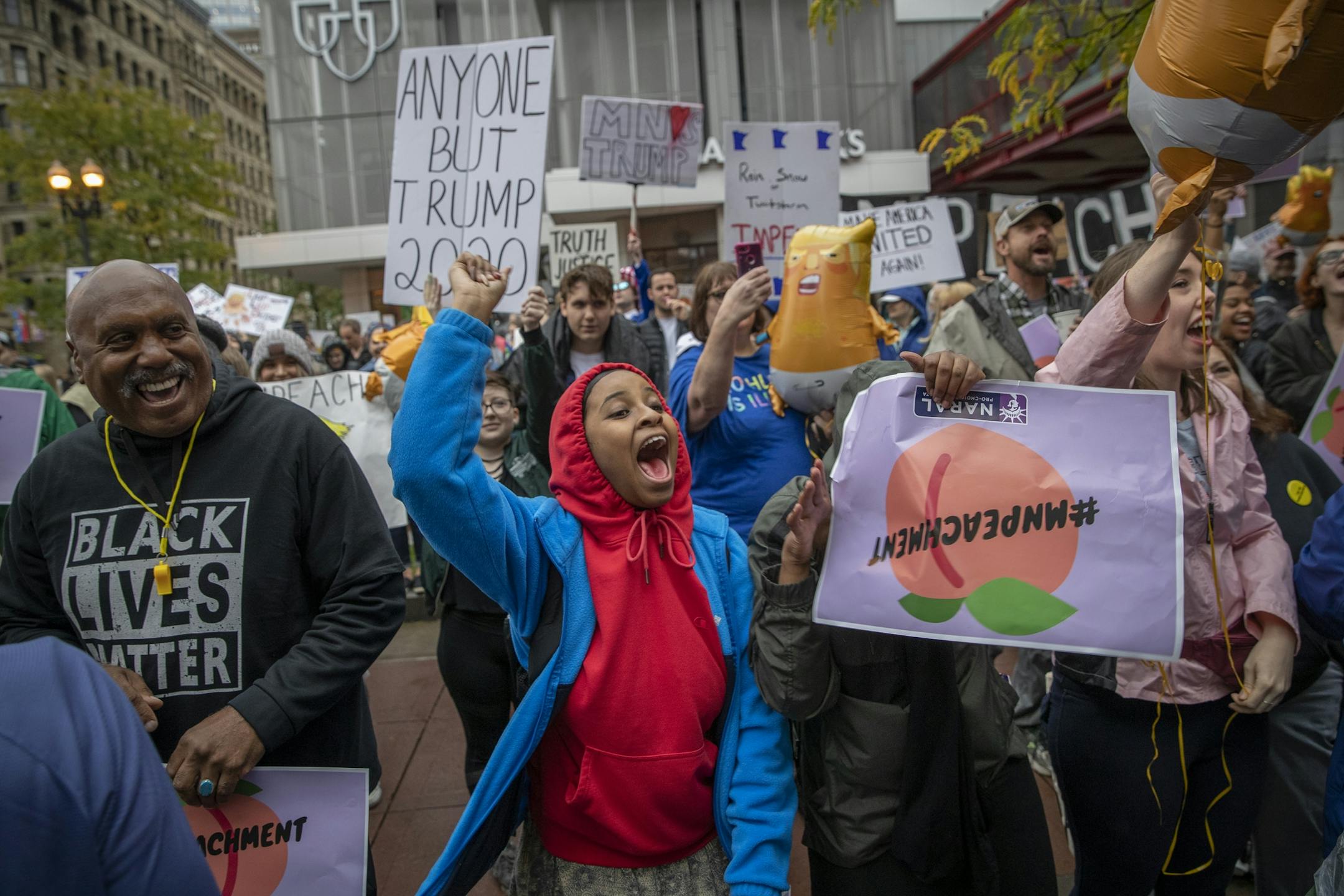 Sarah Ahmed, center, joined hundreds of protestors outside the Target Center before President Trump's visit, Thursday, October 10, 2019 in Minneapolis, MN.