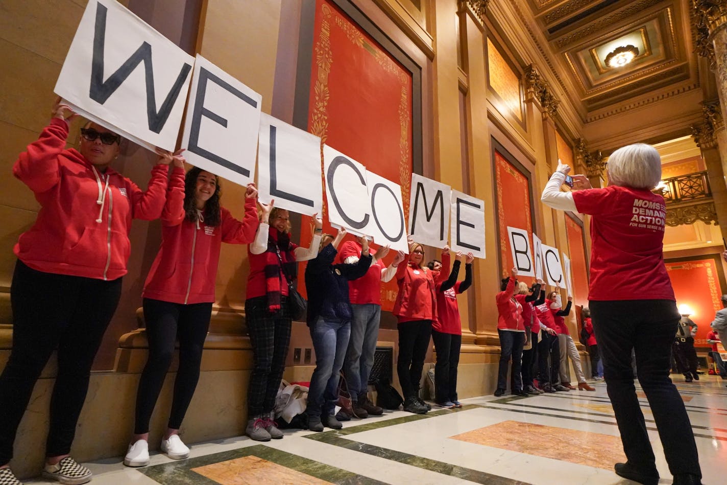 Moms Demand Action chanted "welcome back, welcome back" for returning legislators but were told they cant be louyd outside the Senate Chambers.