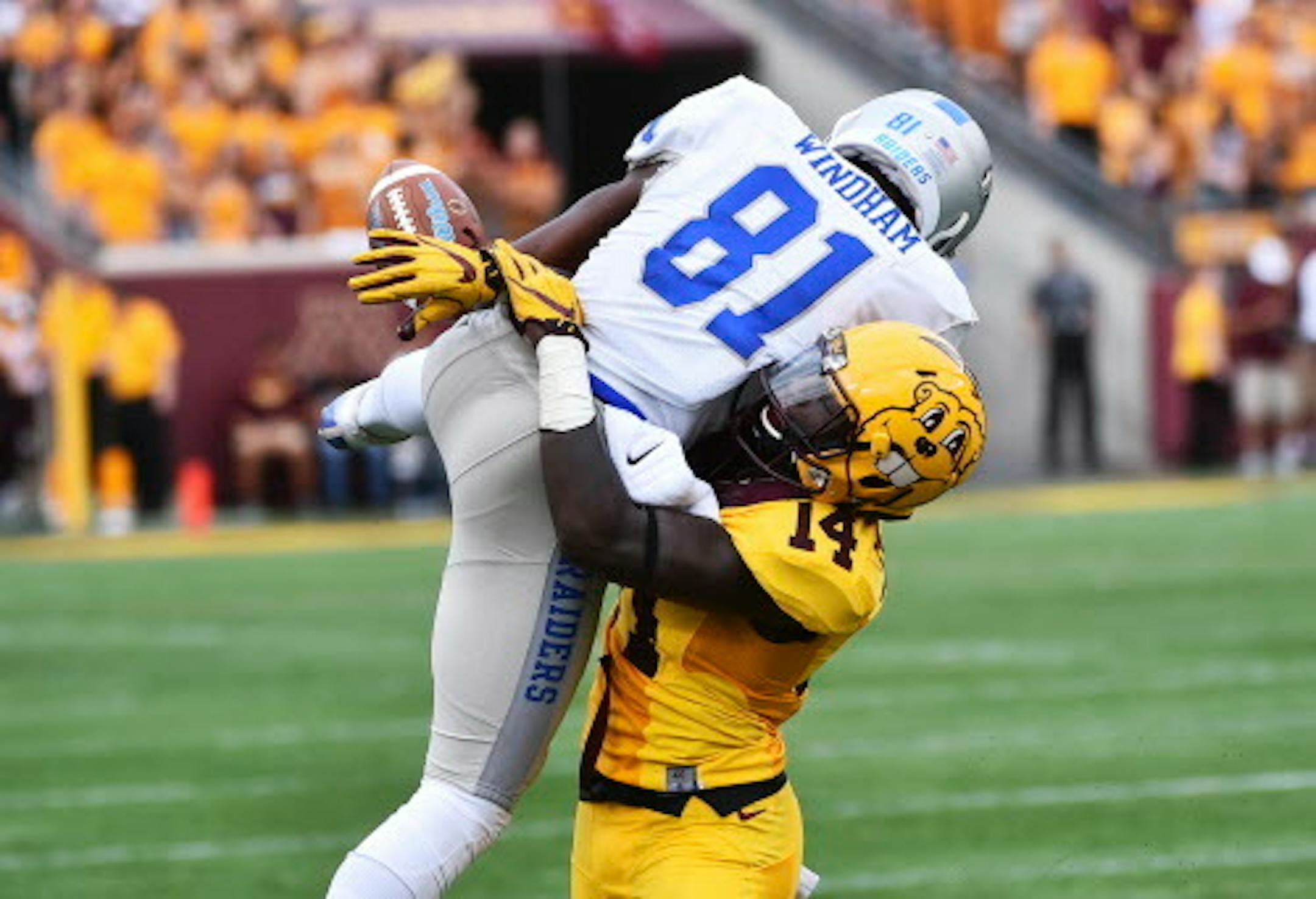 Minnesota defensive back Zo Craighton breaks up a pass to Middle Tennessee wide receiver CJ Windham (in the fist half of a NCAA college football game Saturday, Sept. 16, 2017, in Minneapolis. (AP Photo/John Autey)