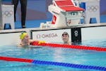 Ariarne Titmus of Australia, left, and Katie Ledecky after the women's in the 400-meter freestyle final in Tokyo, on July 26, 2021, at the postponed 2