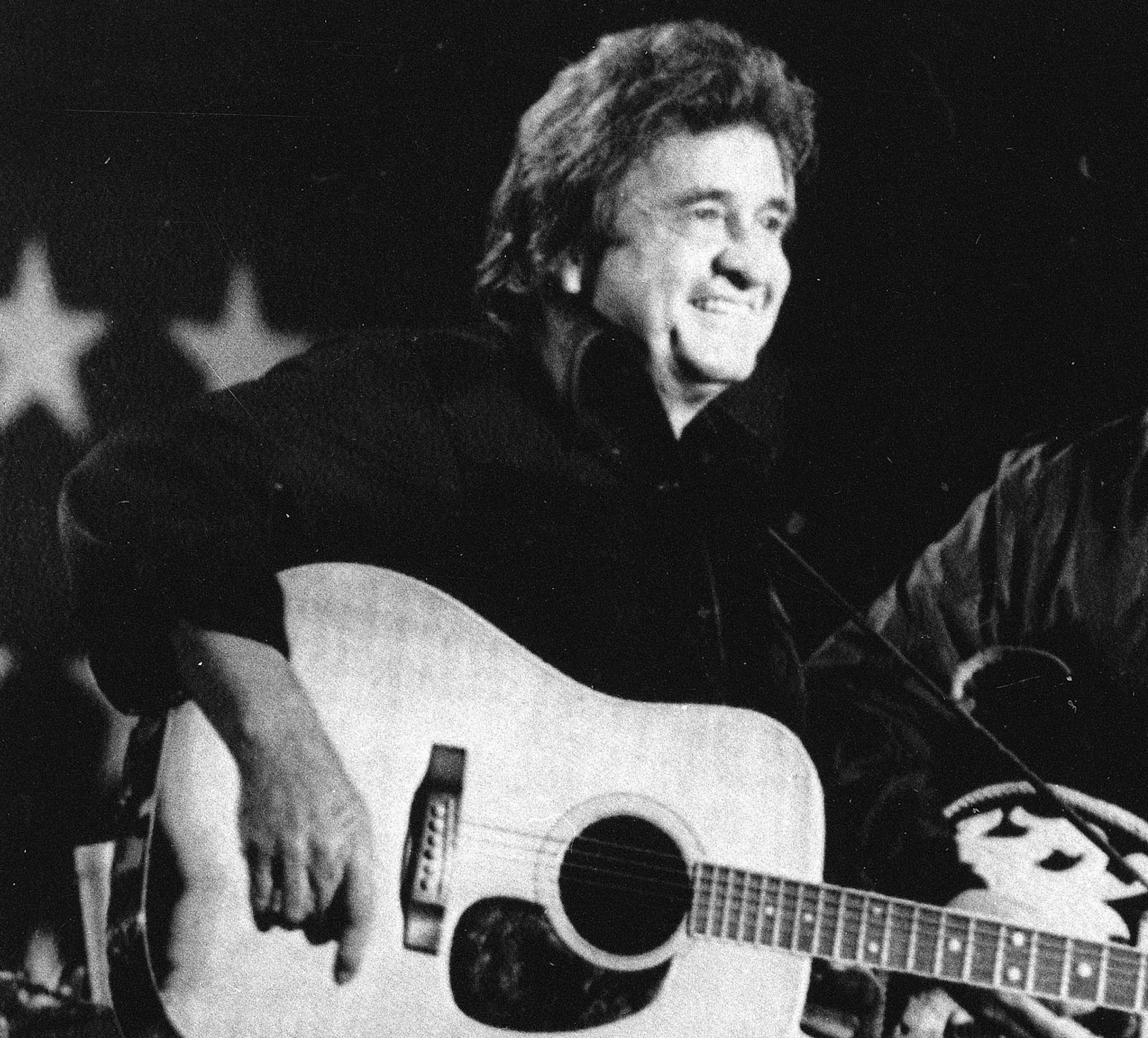 FILE - In this Sept. 23, 1985 file photo, country singer Johnny Cash appears at a FarmAid benefit concert at the University of Illinois in Champaign, Ill. His late-career revival boosted his spirits and was a memorable bookend for his work, and the story behind it lifts "Johnny Cash: American Rebel," a two-hour CMT documentary that premieres Sept. 12 at 9 p.m. EDT, on the 12th anniversary of Cash's death at age 71. (AP Photo/Mary Allen, File)