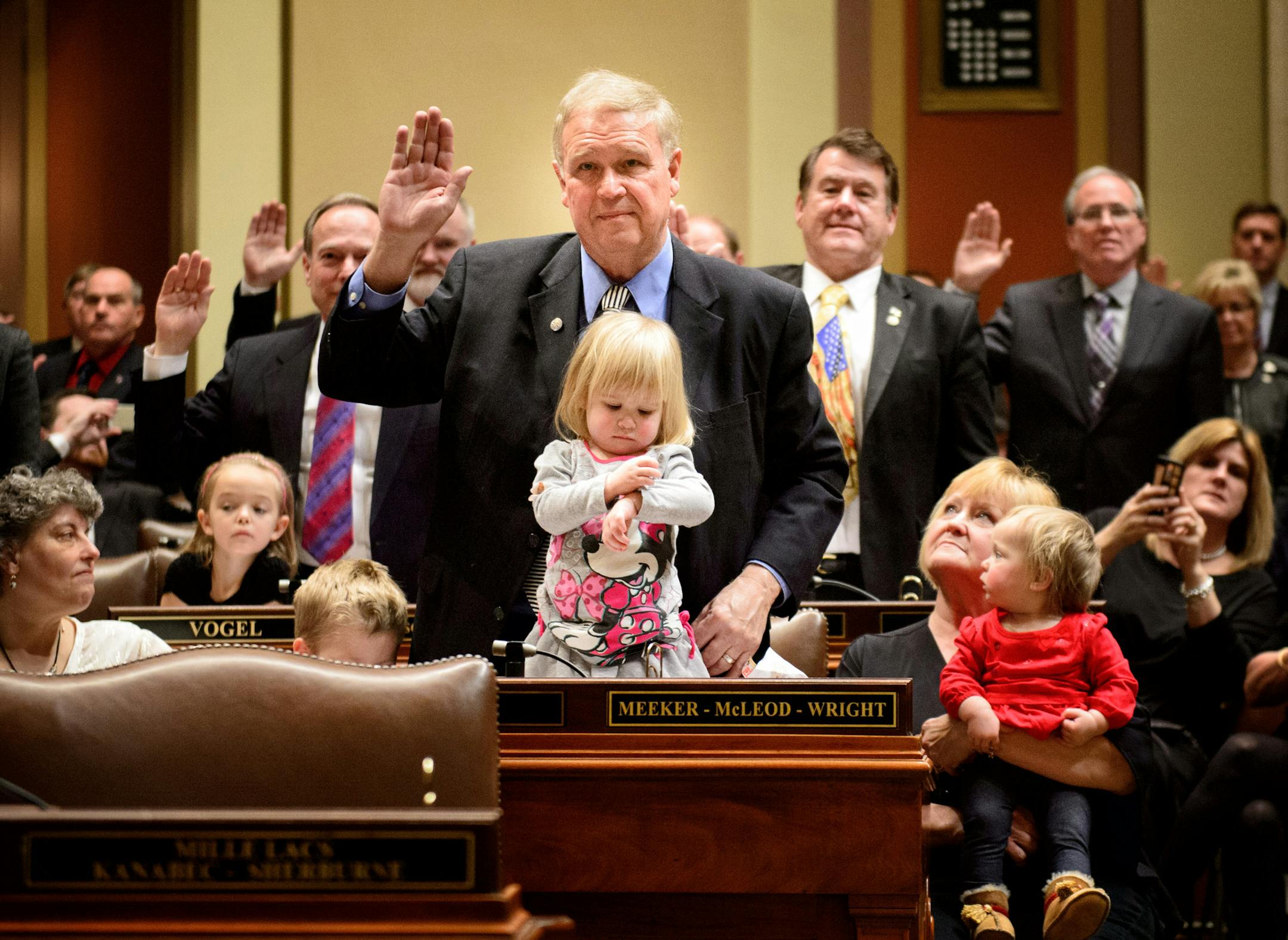 Rep. Dean Urdahl was among the House members sworn in with his grandchildren Mason, seated, Bernadette, 2 and Veronica, 1, held by Karen Urdahl, Dean's wife. ] GLEN STUBBE * gstubbe@startribune.com Tuesday, January 6, 2015 The Minnesota House and Senate re-convene, with much ceremony, family and guests. In the House, Speaker Kurt Daudt will take the gavel back for the GOP.