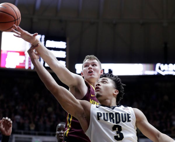 Purdue guard Carsen Edwards (3) shoots in front of Minnesota forward Michael Hurt (42) in the second half of an NCAA college basketball game in West L