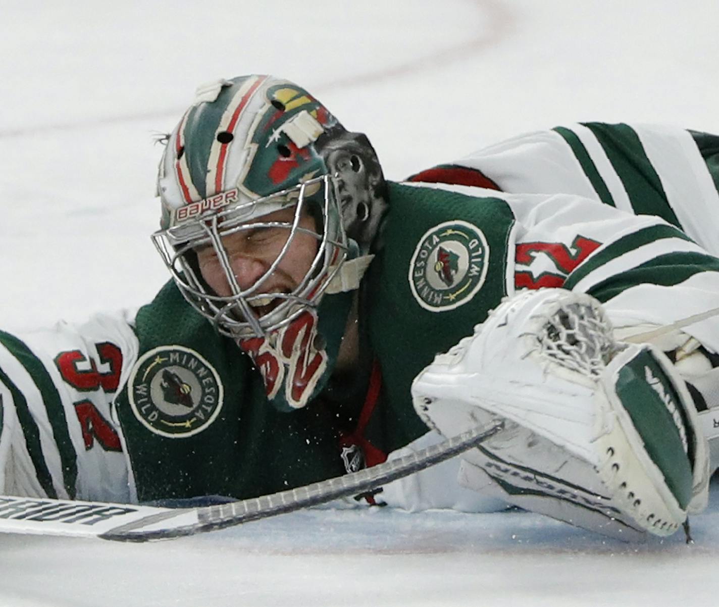 Minnesota Wild goaltender Alex Stalock blocks a shot by Vegas Golden Knights right wing Mark Stone during the second period of an NHL hockey game Tuesday, Dec. 17, 2019, in Las Vegas. (AP Photo/John Locher)