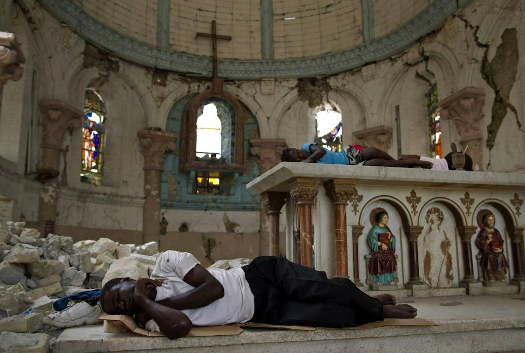 Two years after the earthquake, homeless people continue to sleep in the destroyed Santa Ana Church in Port-au-Prince.