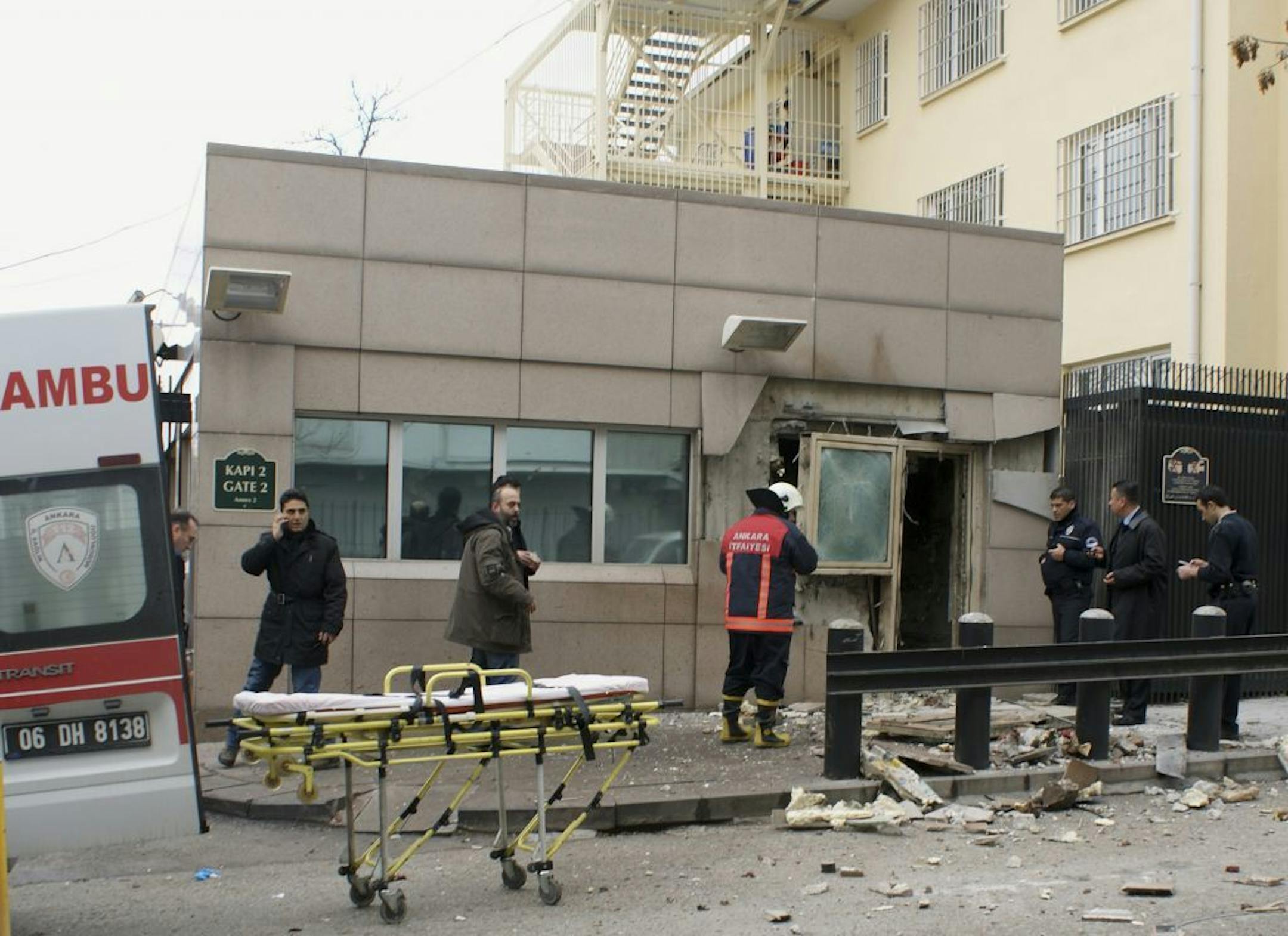 Gate 2 of the embassy just after a suicide bomber had detonated an explosive device at the entrance of the U.S. Embassy in the Turkish capital, Ankara, Turkey, Friday, Feb. 1, 2013, The bomb appeared to have exploded inside the security checkpoint at the entrance of the visa section of the embassy. A police official said at least two people are dead.
