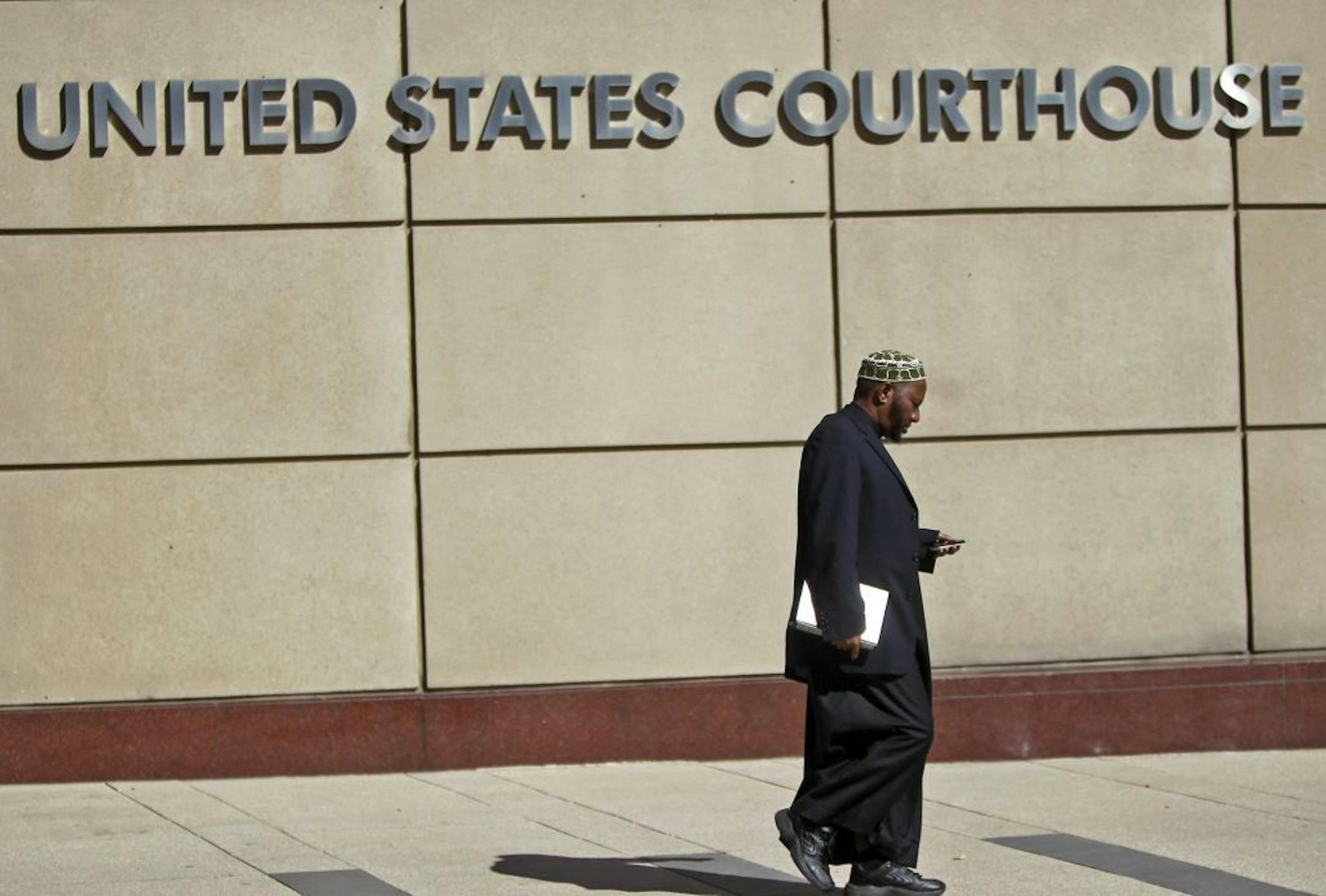 Family and supporters of Mahamud Said Omar made their way to and from the Federal Courthouse for opening arguments for his trial, Tuesday, October 2, 2012. Omar is charged with recruiting and arming young men who left here to fight in Somali. (ELIZABETH FLORES/STAR TRIBUNE) ELIZABETH FLORES � eflores@startribune.com