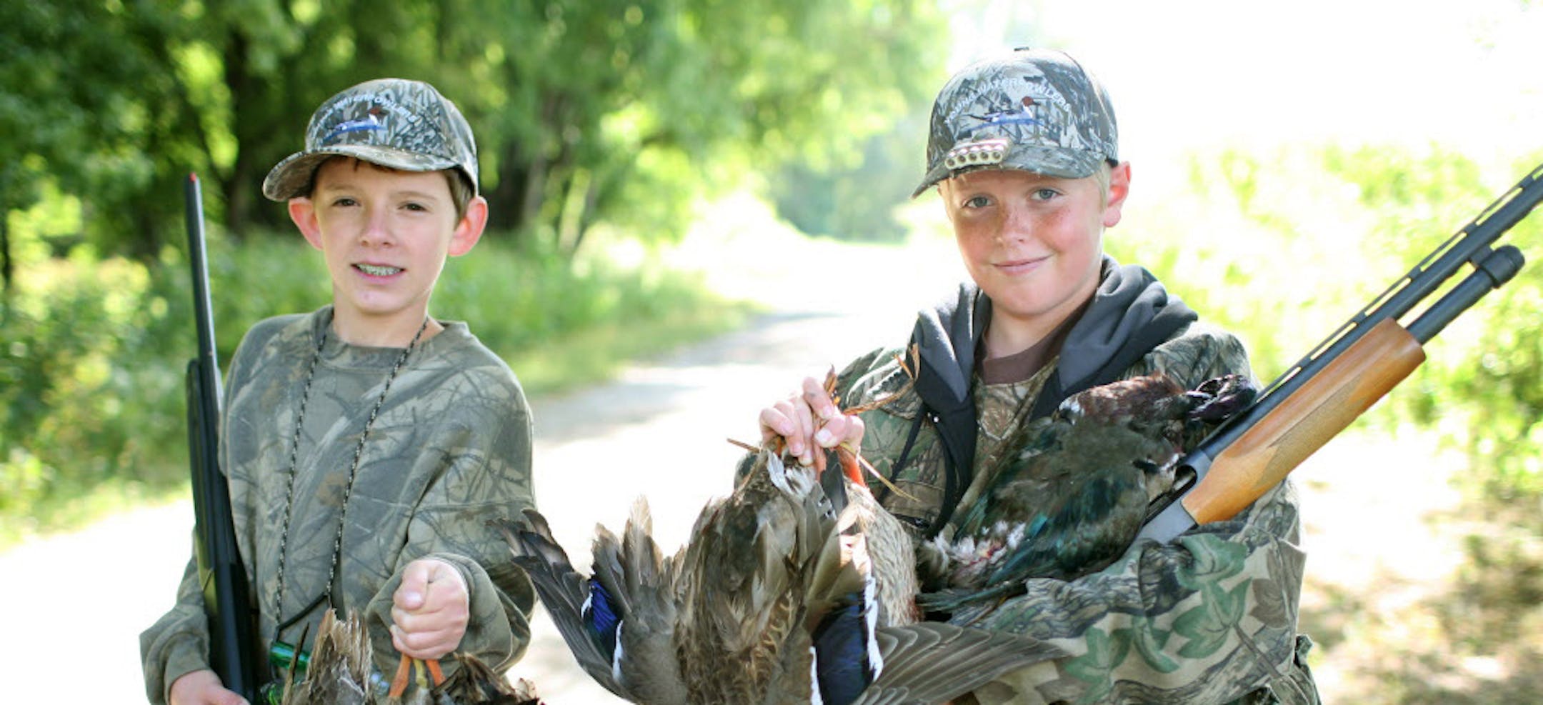 Trevor Lenzen, left, and Nelson Brothers, participated in Minnesota's Youth Waterfowl Day in 2012. This year the 19th annual event is Saturday. ORG XMIT: MIN1401081655010047