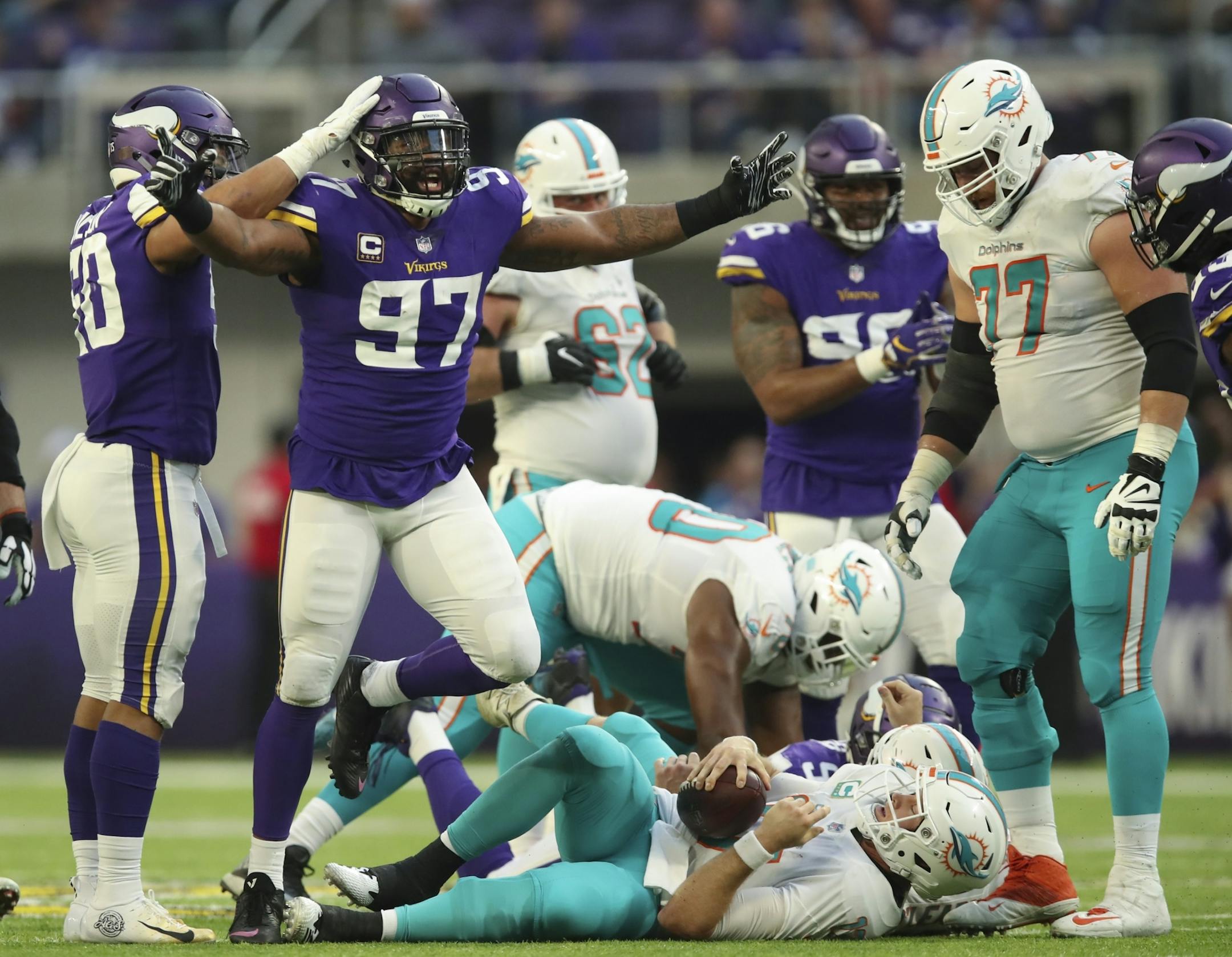 Vikings defensive end Everson Griffen (97) rejoiced after he sacked Miami Dolphins quarterback Ryan Tannehill (17) for a 10 yard loss on a fourth down play in the fourth quarter.