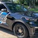 A Coon Rapids police officer is recovering at home after she was hit by a passing pickup truck while clearing debris from the road. 