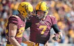 Minnesota Gophers quarterback Mitch Leidner, right, celebrated wide receiver Drew Wolitarsky's touchdown in the first quarter as the Gophers took on I