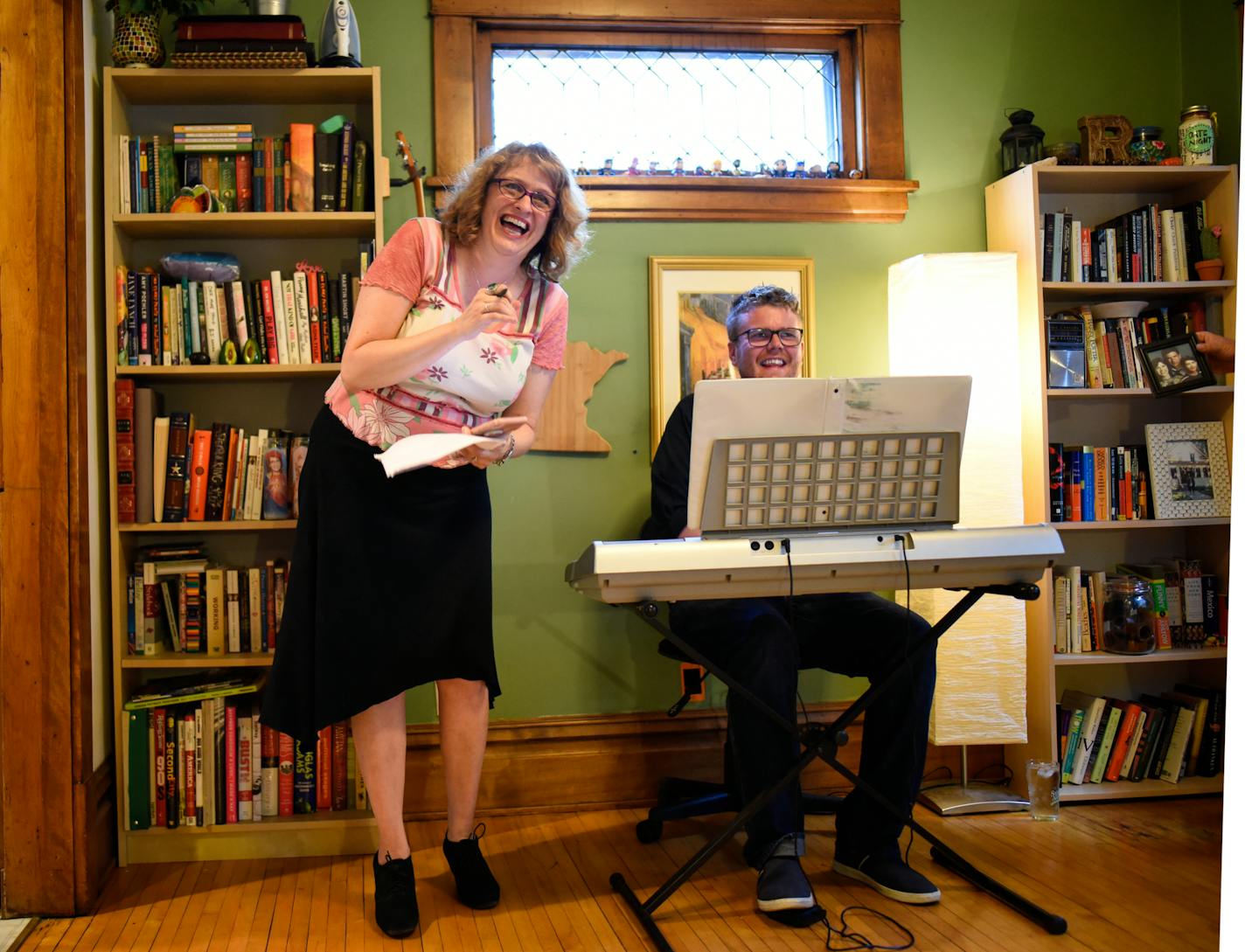 Shanan Custer shared a laugh with pianist Keith Hovis as they took part in a rehearsal for &#xec;Couple Fight: The Musical!&#xee; Wednesday afternoon. ] AARON LAVINSKY &#xef; aaron.lavinsky@startribune.com Feature on Shanan Custer, a writer, director and actor involved in five shows at the 25th annual Minnesota Fringe Festival. We photograph Custer at a rehearsal for "Couple Fight: The Musical," at the home of Tom Reed and Anna Weggel-Reed on Wednesday, July 25, 2018 in Minneapolis. Tom is the d