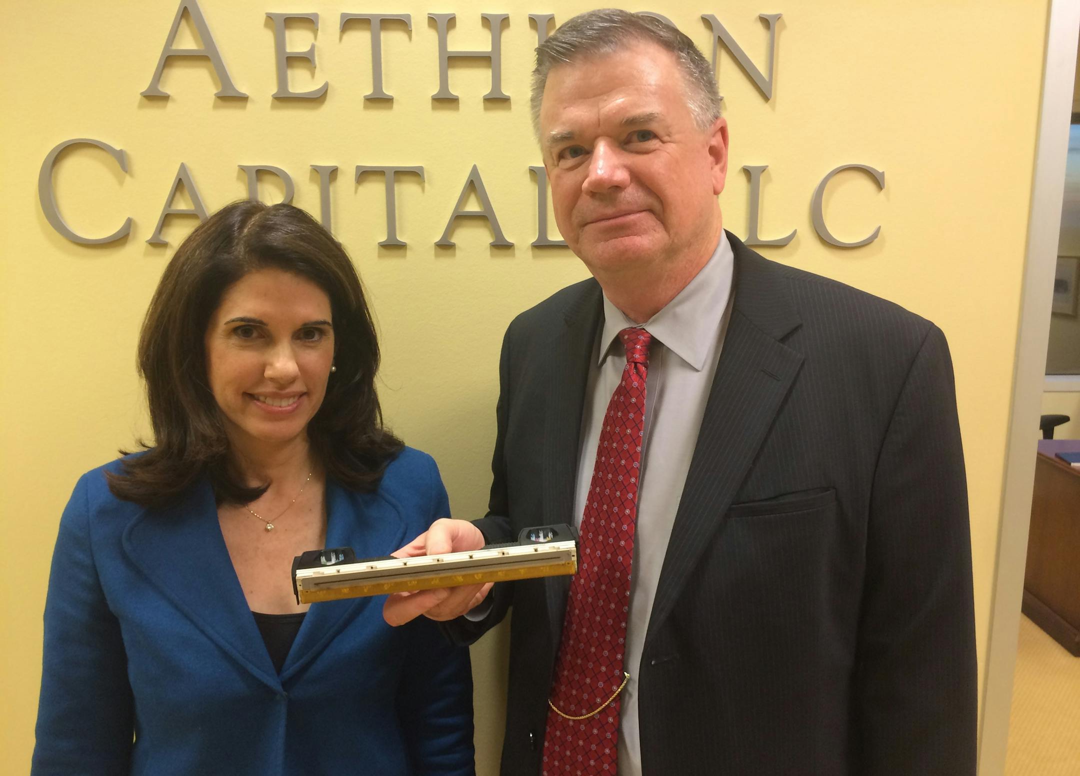 Investment banker Sima Griffith of Aethlon Capital found an investor with Minnesota roots to finance expansion for CEO Dieter Schilling of Delphax Technologies. Schilling is holding a high-volume Memjet printing head used on the new Delphax Elan series printers.