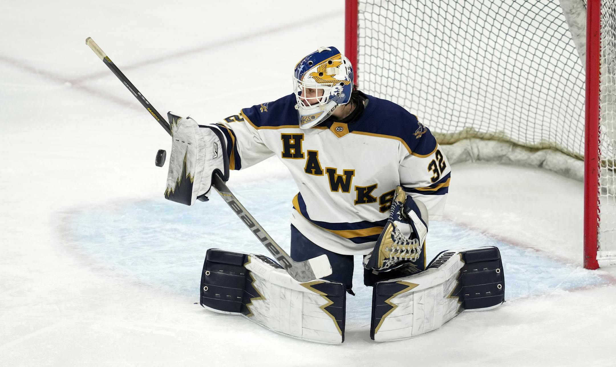 Hermantown goaltender Dane Callaway (32) makes a save in the first period of a MSHSL Class 1A quarterfinal hockey game between Luverne and Hermantown.