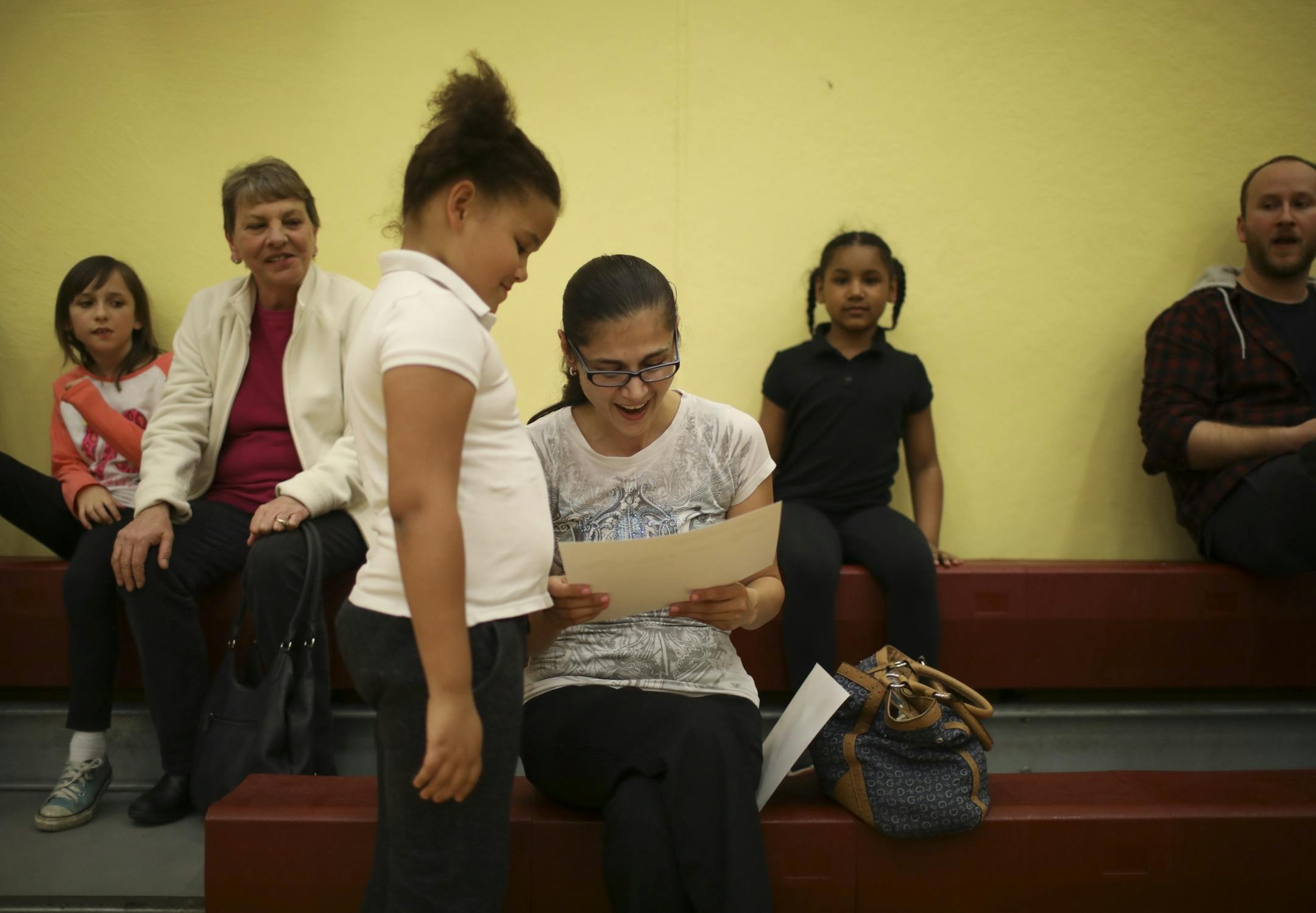 Denise Hayes, 8, and a second grader, proudly shared her attendance award with her mom, Denise Mlejnek.