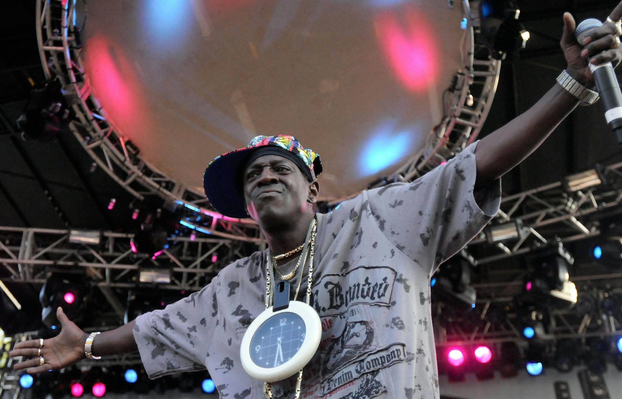 FILE - In this Aug. 30, 2009 file photo, Flavor Flav of Public Enemy performs during the Virgin Mobile Freefest concert at Merriweather Post Pavilion in Columbia, Md. Entertainer Flavor Flav has a scheduling conflict between a court date in Las Vegas and his induction with the rap group Public Enemy into the Rock and Roll Hall of Fame in Los Angeles. He's due for arraignment Thursday, April 18, 2013, on felony charges that he chased and threatened his longtime girlfriend's 17-year-old son with a