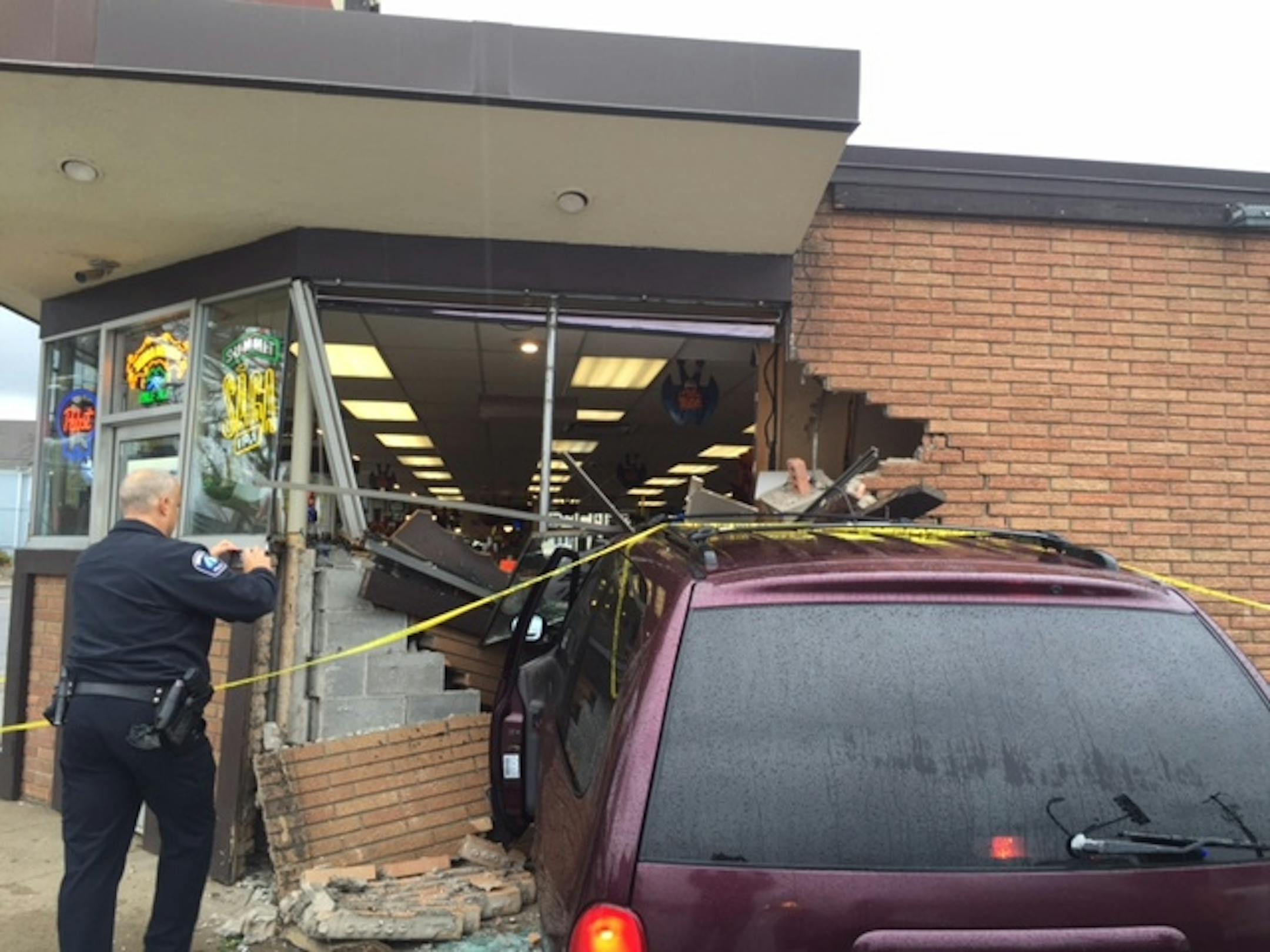 Photo courtesy of Robert Marget: A minivan smashed into the River Liquor Store in northeast Minneapolis on Saturday.