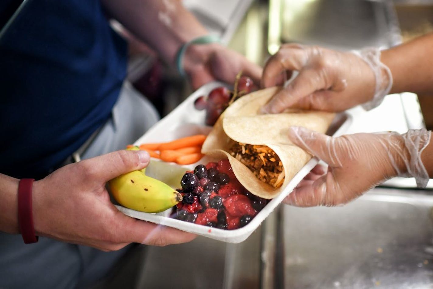 A cafeteria worker made burritos at Owatonna High School cafeteria.