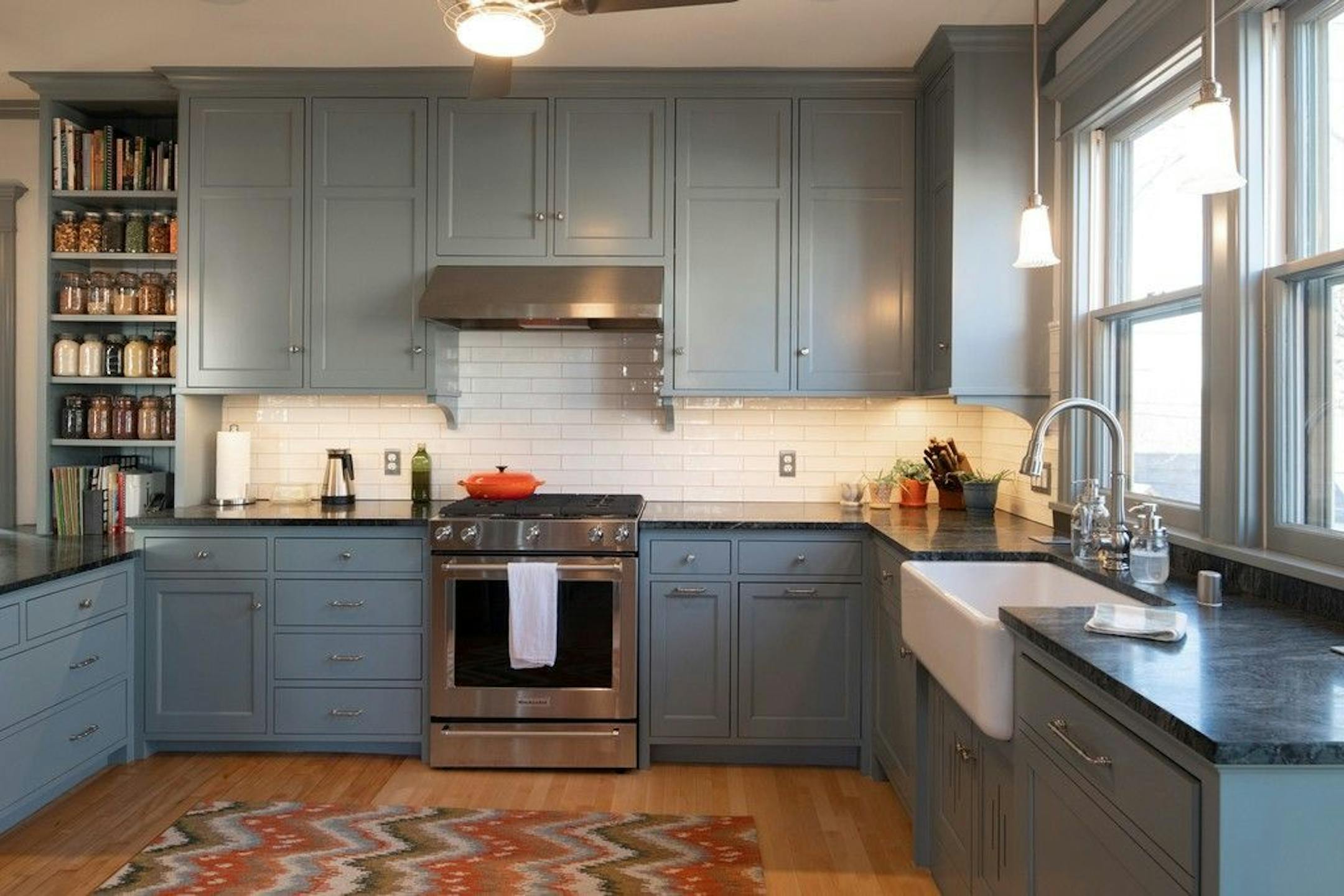The kitchen, formerly two small rooms (one for eating, one for cooking), is now one large functional space.