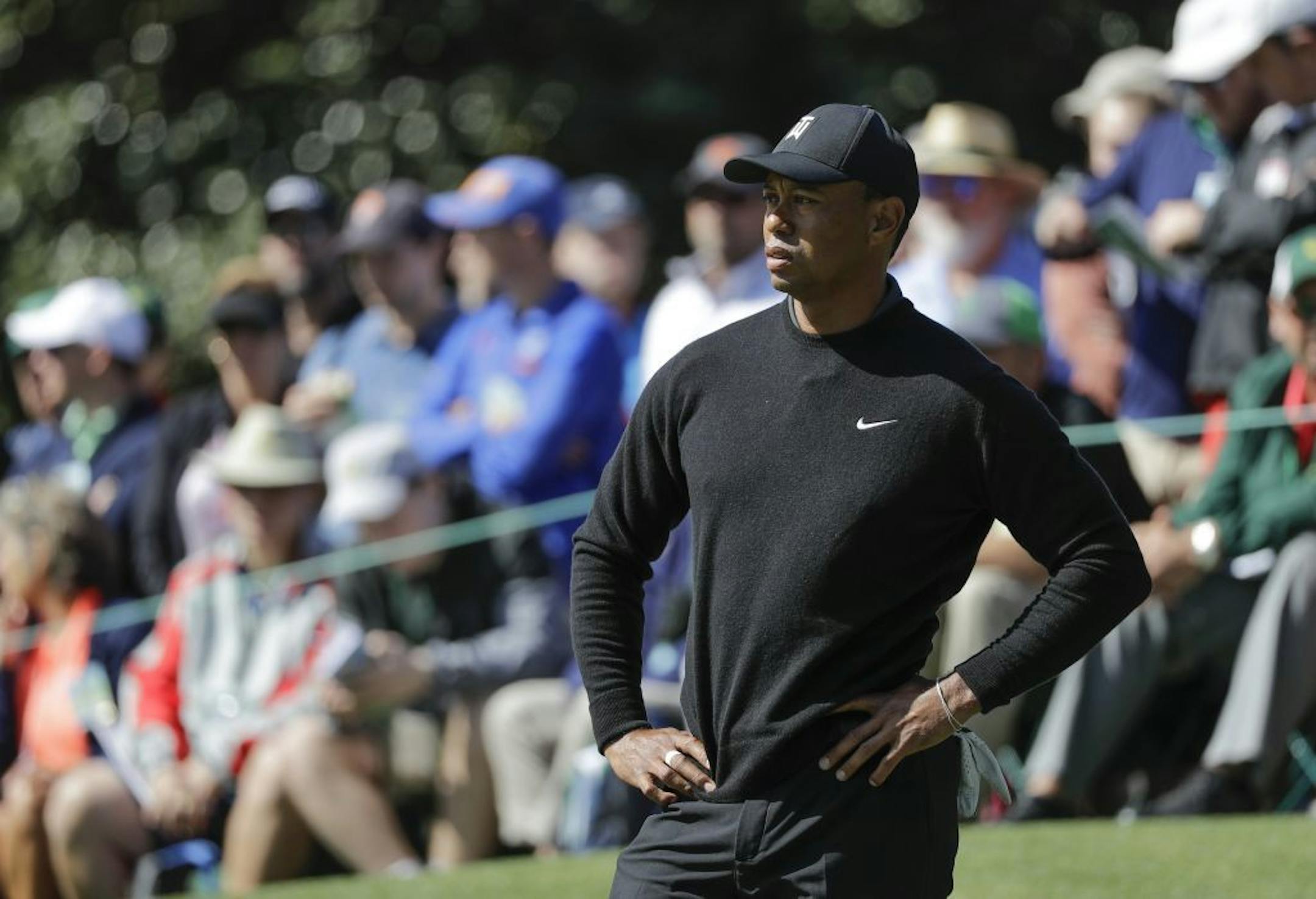 Tiger Woods waits to putt on the first hole during the first round at the Masters golf tournament Thursday, April 5, 2018, in Augusta, Ga.