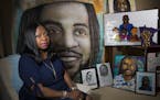 Valerie Castile posed for a picture with artwork and gifts strangers have made for her since the death of her son Philando Castile in 2016. She was ph